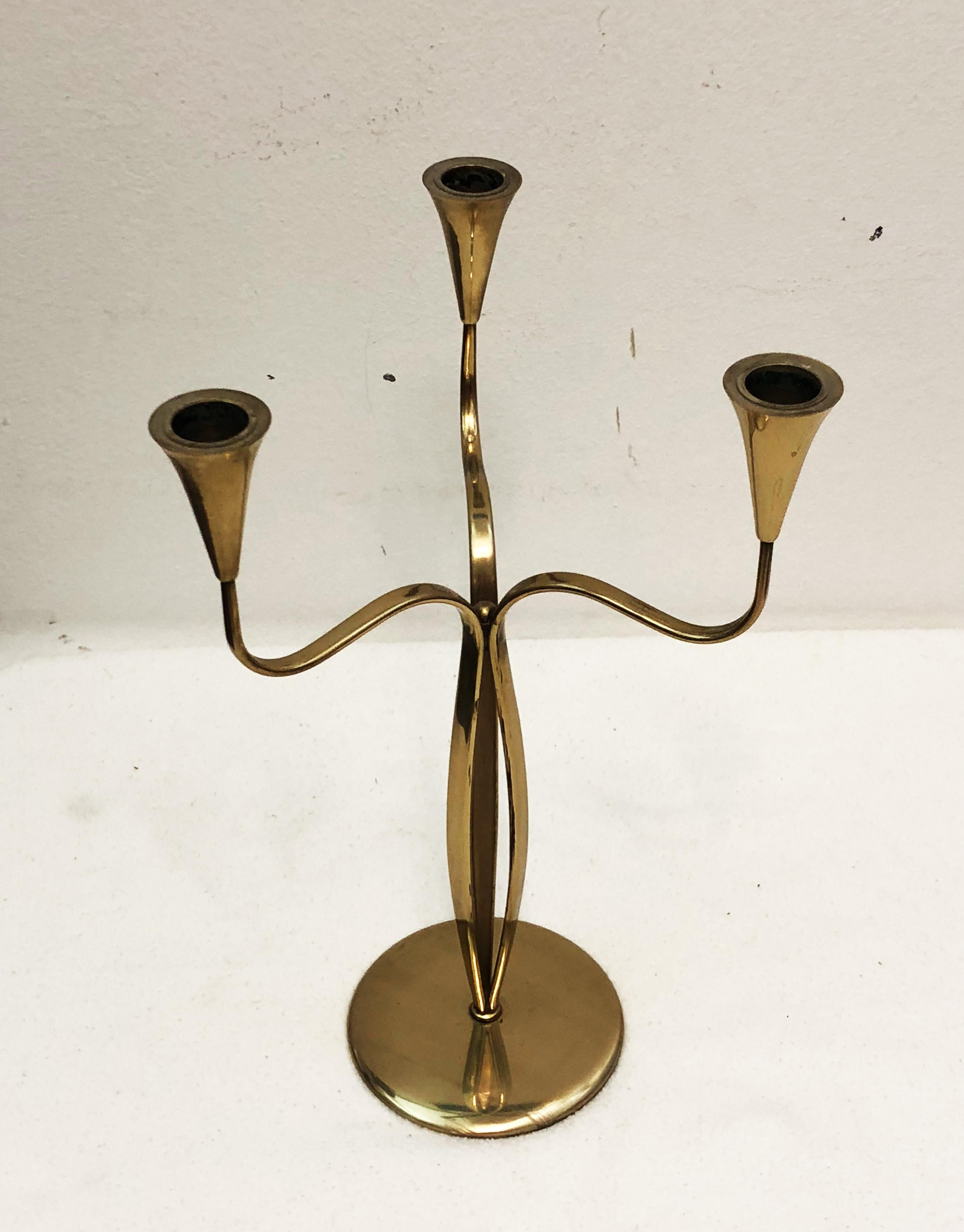 Brass candlestick, made in Denmark in the 1960s
Measures: Height 32cm, diameter 22cm.
Used but in very good condition.
