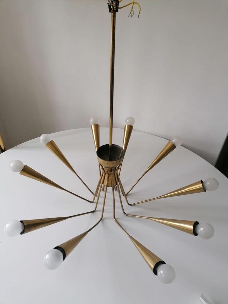 Brass construction with ten arms each fitted with E14 sockets. Made in Vienna by Rupert Nikoll in the late 1950s.
 