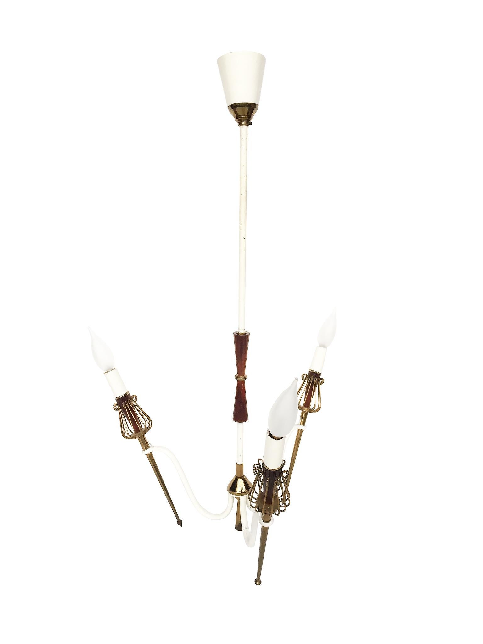 This three-light chandelier was created in the 1950s, in the style of Maison Lunel. Like the lamps and ceiling lights made by Maison Lunel, this chandelier combines modern and more traditional forms. The result is a balanced mix of minimal, spare