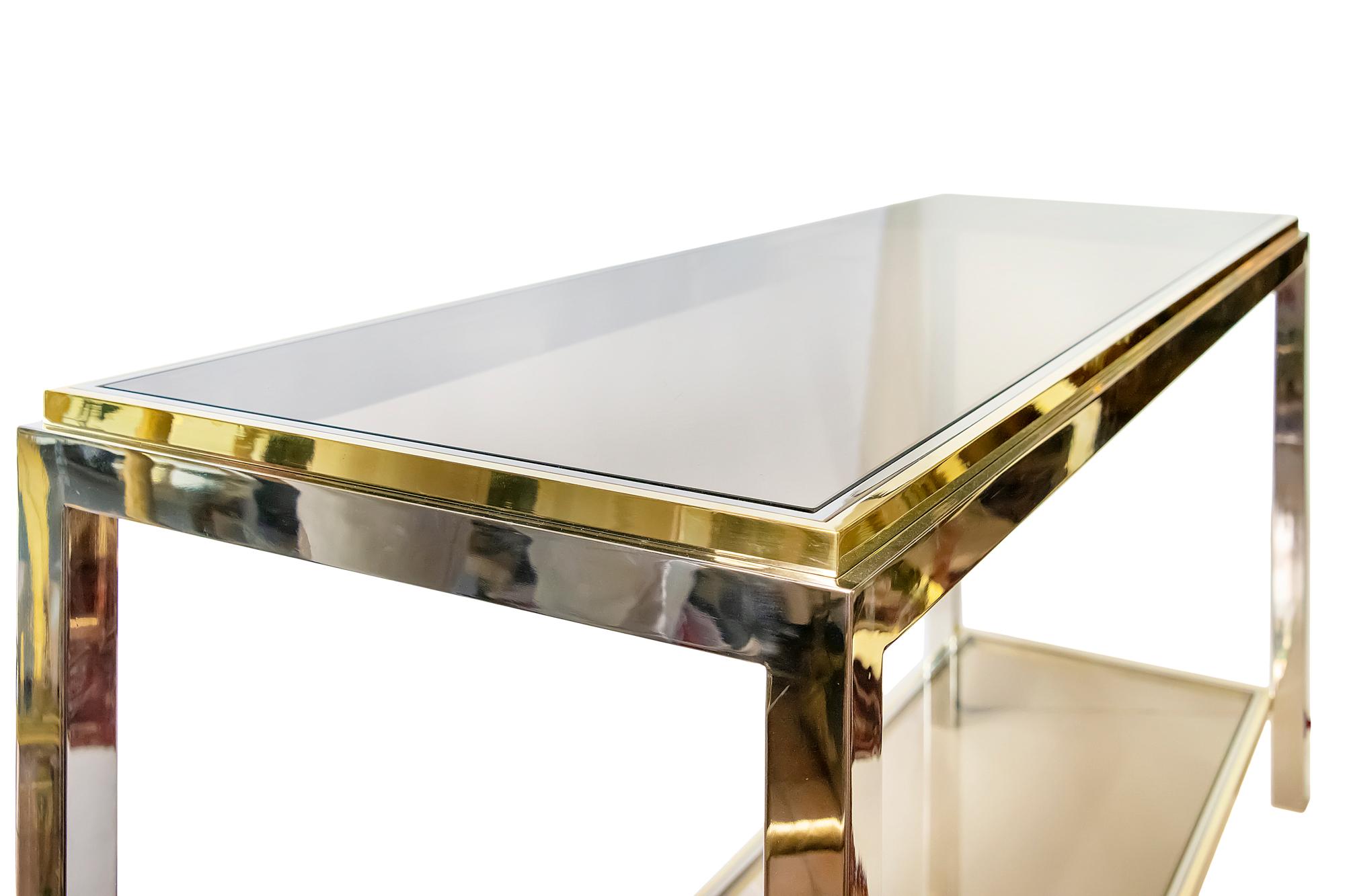 Midcentury brass, chrome and glass console table.
The top and down shelve of this console are with brown glass.
Overall very good condition.