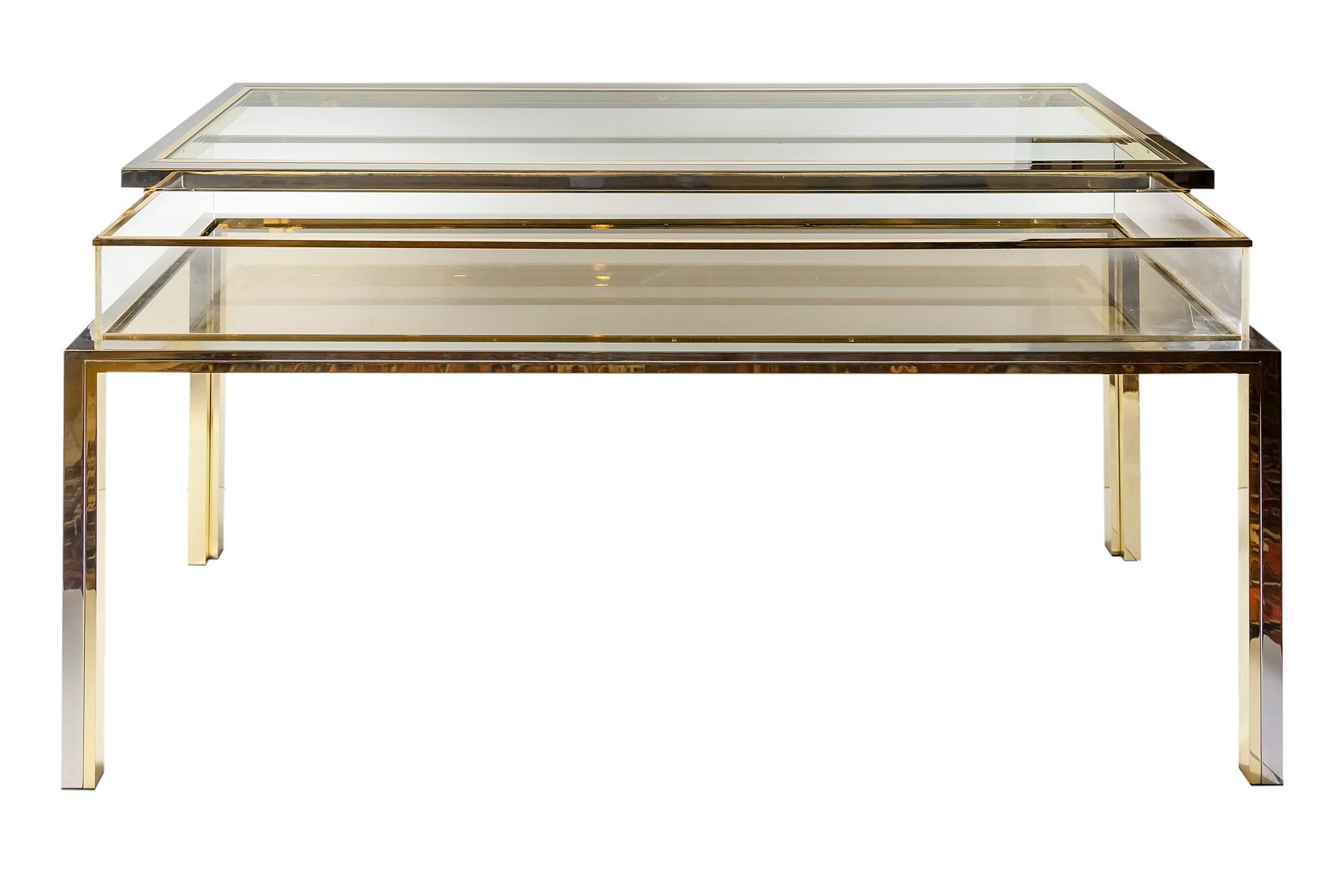 Italian midcentury brass, chrome, glass and plexi console table/showcase, design Romeo Rega. The top is with showcase function and opens to one side.
All metal is new polished.
Very heavy.