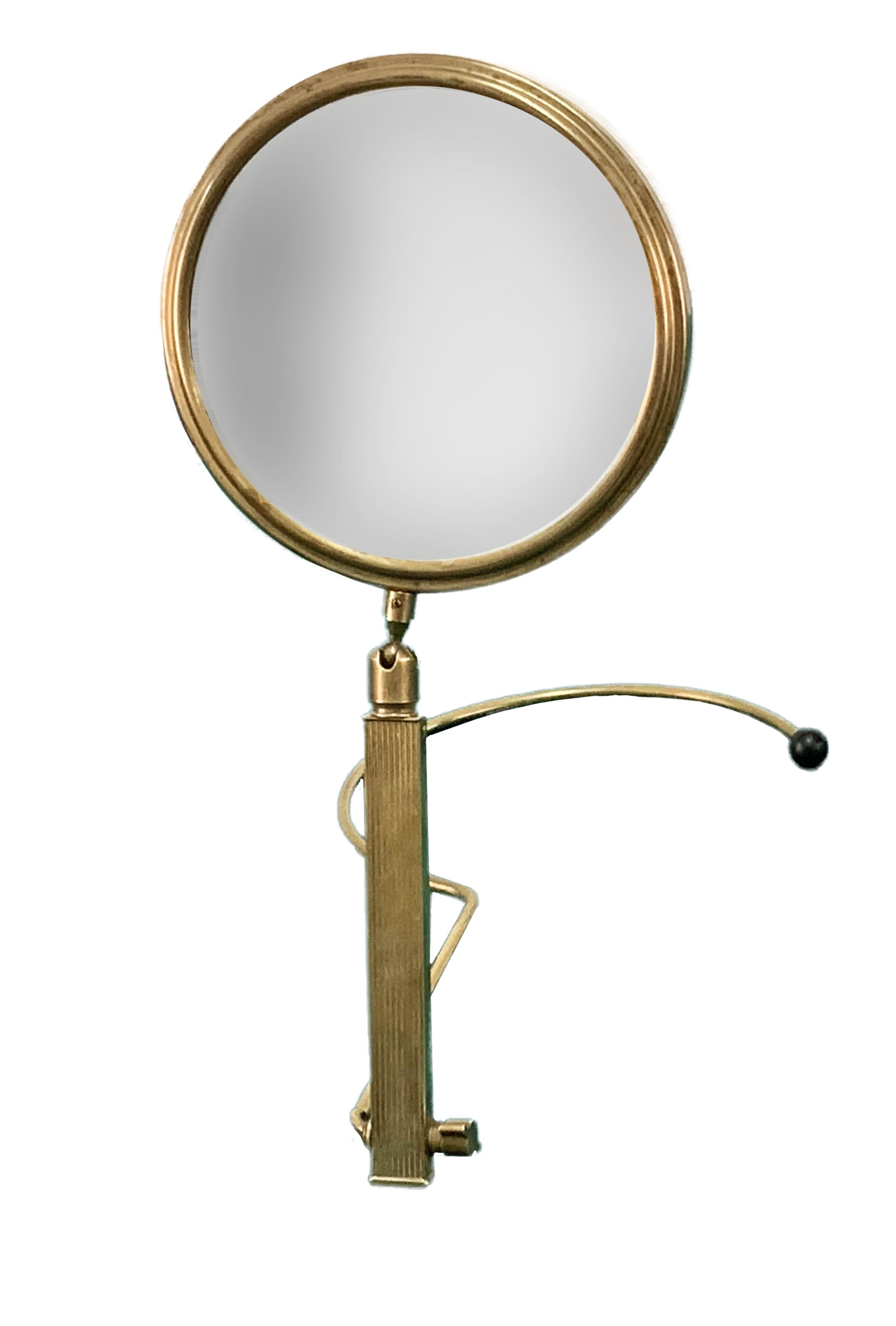 Beautiful midcentury brass table mirror, the article was produced in France during the 1950s.

This amazing piece is made of brass with an adjustable two-sides stand.

It is a wonderful item, ideal for a bathroom or a midcentury bedroom. There