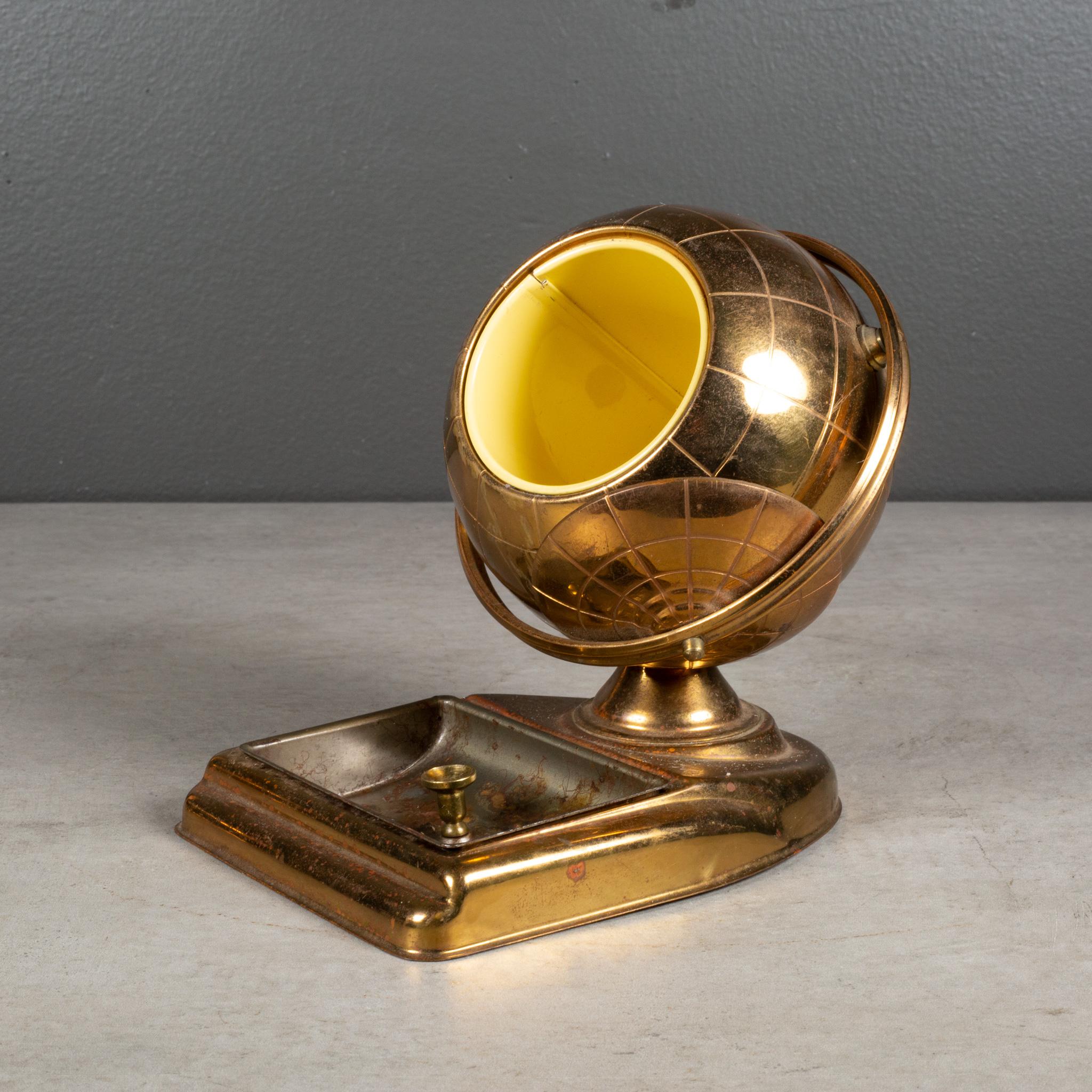 ABOUT

An original mid-century brass cigarette holder and ashtray or coin dish. The lid slides open on the globe's axis to reveal a metal interior designed to hold cigarettes. This globe is unique because it has an attached tray.

 CREATOR: