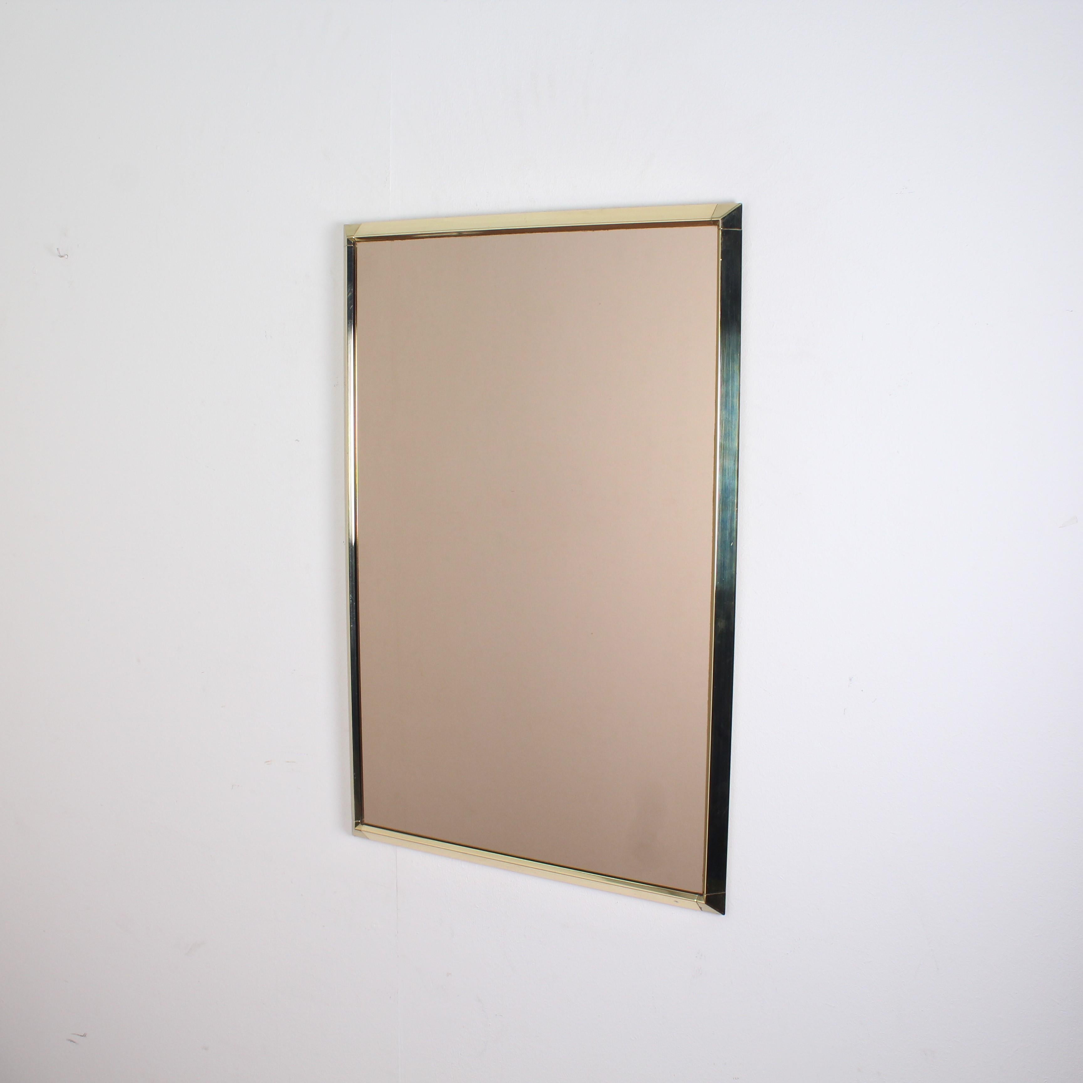 Minimalist midcentury brass Italian mirror, 1970s 
Wear with age and use.