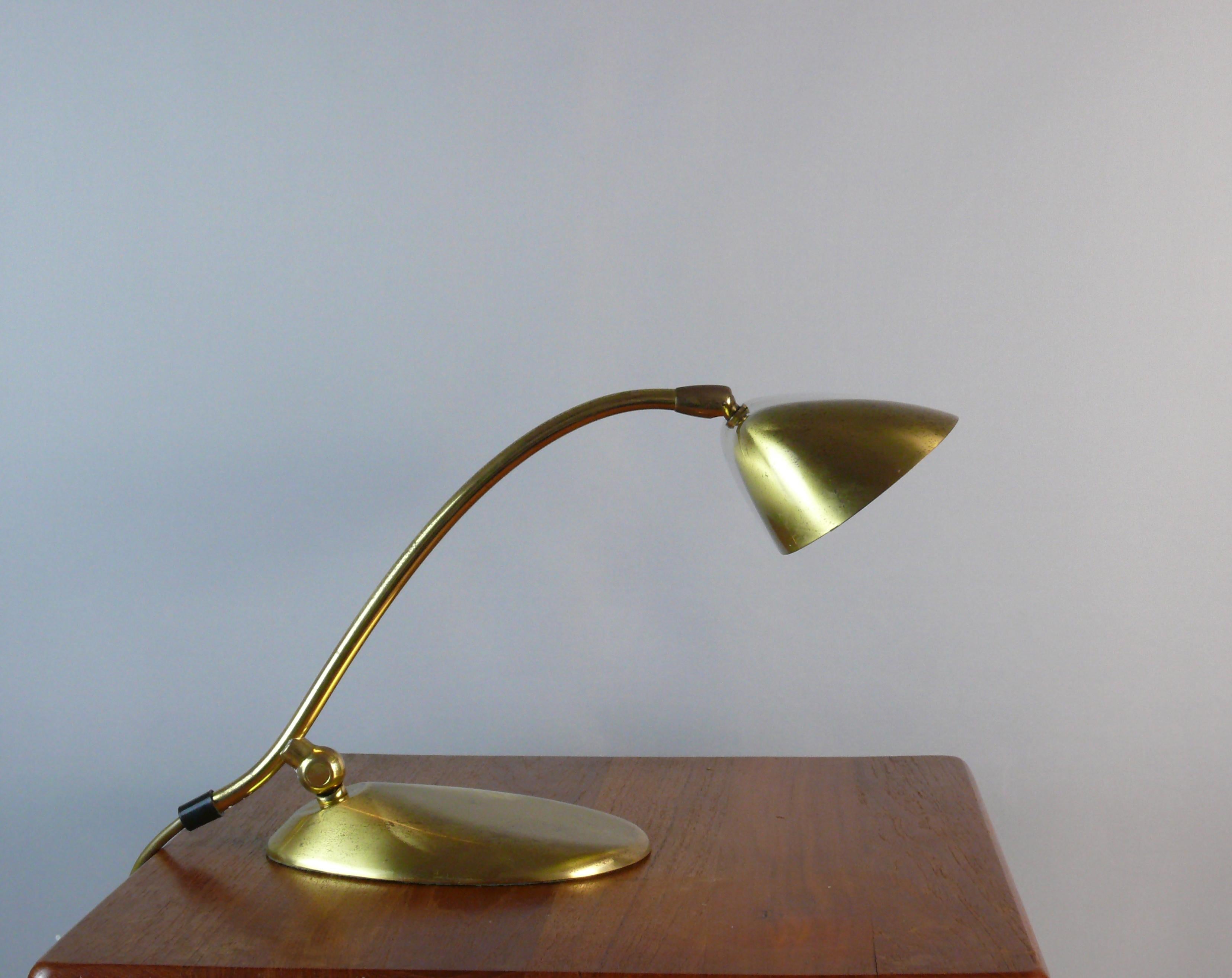 Very solid and rare piano lamp made of brass by JBS (Joseph Brumberg Sundern), West Germany, around the 1960s. The lamp impresses with its organic shape. The lamp is made of brass with a heavy metal base. The screen can be tilted with a ball joint.