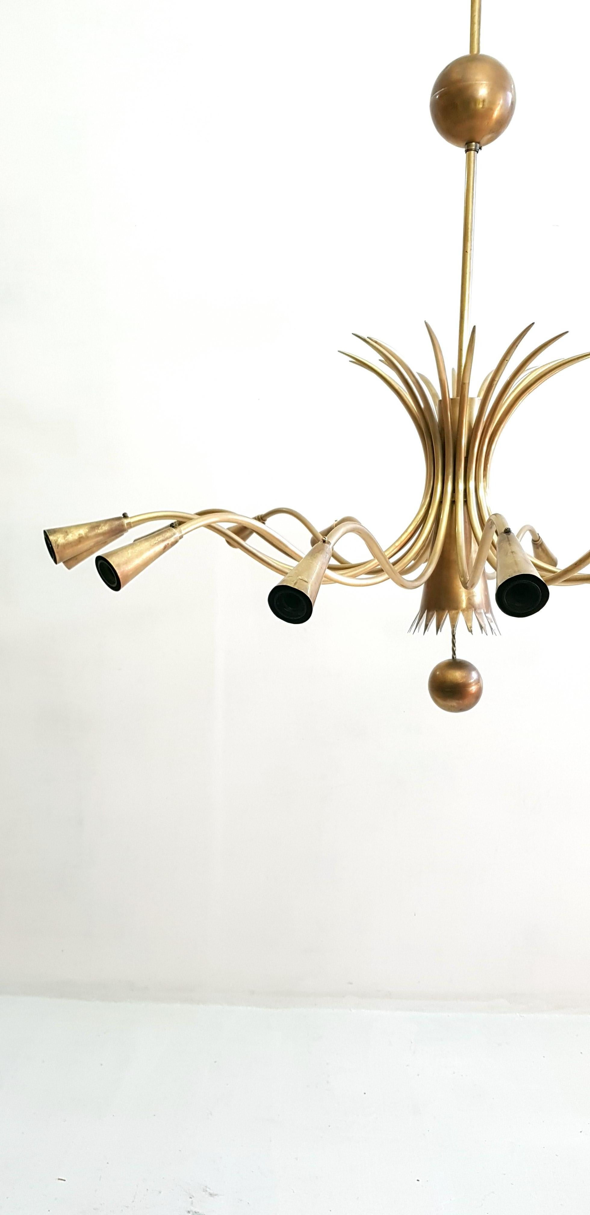 Rare and large midcentury chandelier in brass with sixteen arms in the manner of Guglielmo Ulrich, Italy. Fully functioning and in original condition.