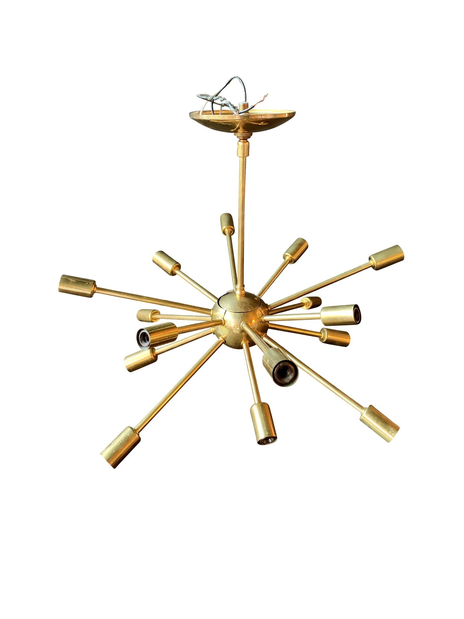 A classic Midcentury Sputnik brass chandelier. It consists of 16 arms radiating, each culminating in a single bulb socket.

Dimensions:
20 in. diameter
15.75 in. height

Condition notes:
In good condition. General wear consistent with the