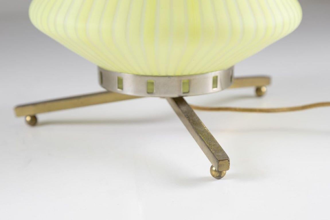 Refined table lamp made of brass metal and glass, sublime quality in the making of glass surely from Murano.
The idea of this lamp through the hook at the top is to be able to move it easily.
Lamp definitely suitable for a side table or bedside