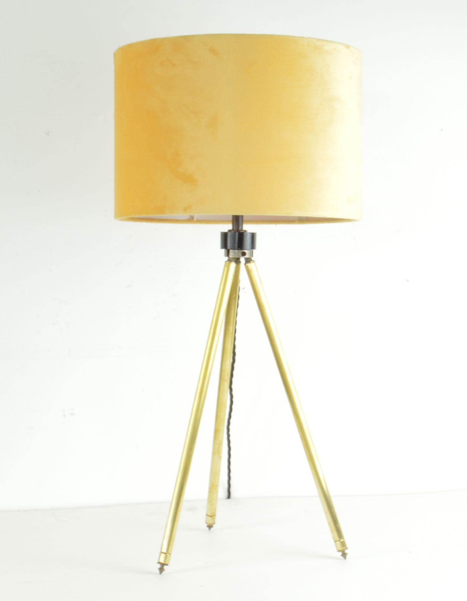 Super brushed brass tripod table lamp.

Yellow velvet shade

Telescopic so the height can be adjusted. The measurement given below relates to the position in the image.

Converted from a vintage camera tripod.

Re-wired to UK