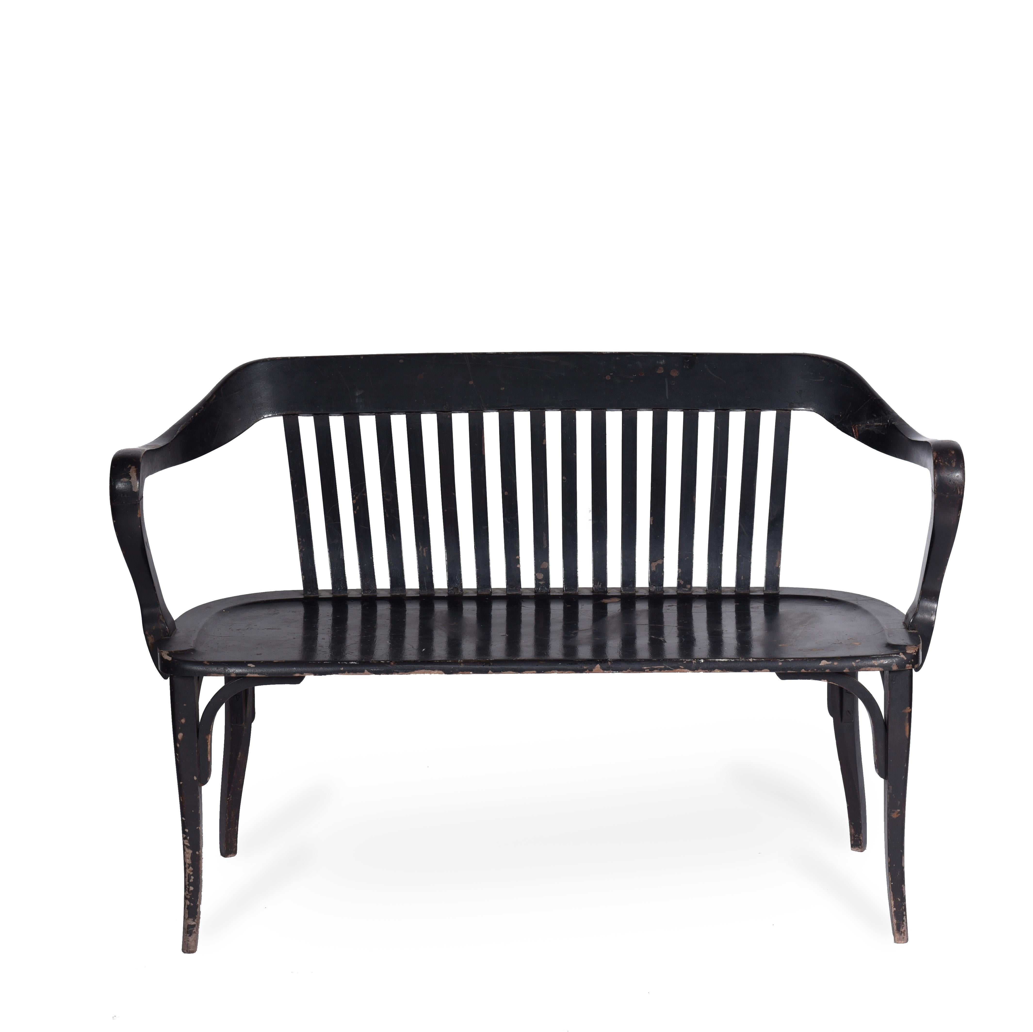 Midcentury Brazilian bench in lacquered wood, 1950s

Of unknown authorship, this bench in wood lacquered in black color is all built in wood. Its back is composed of strips of wood and the arms have been worked manually.