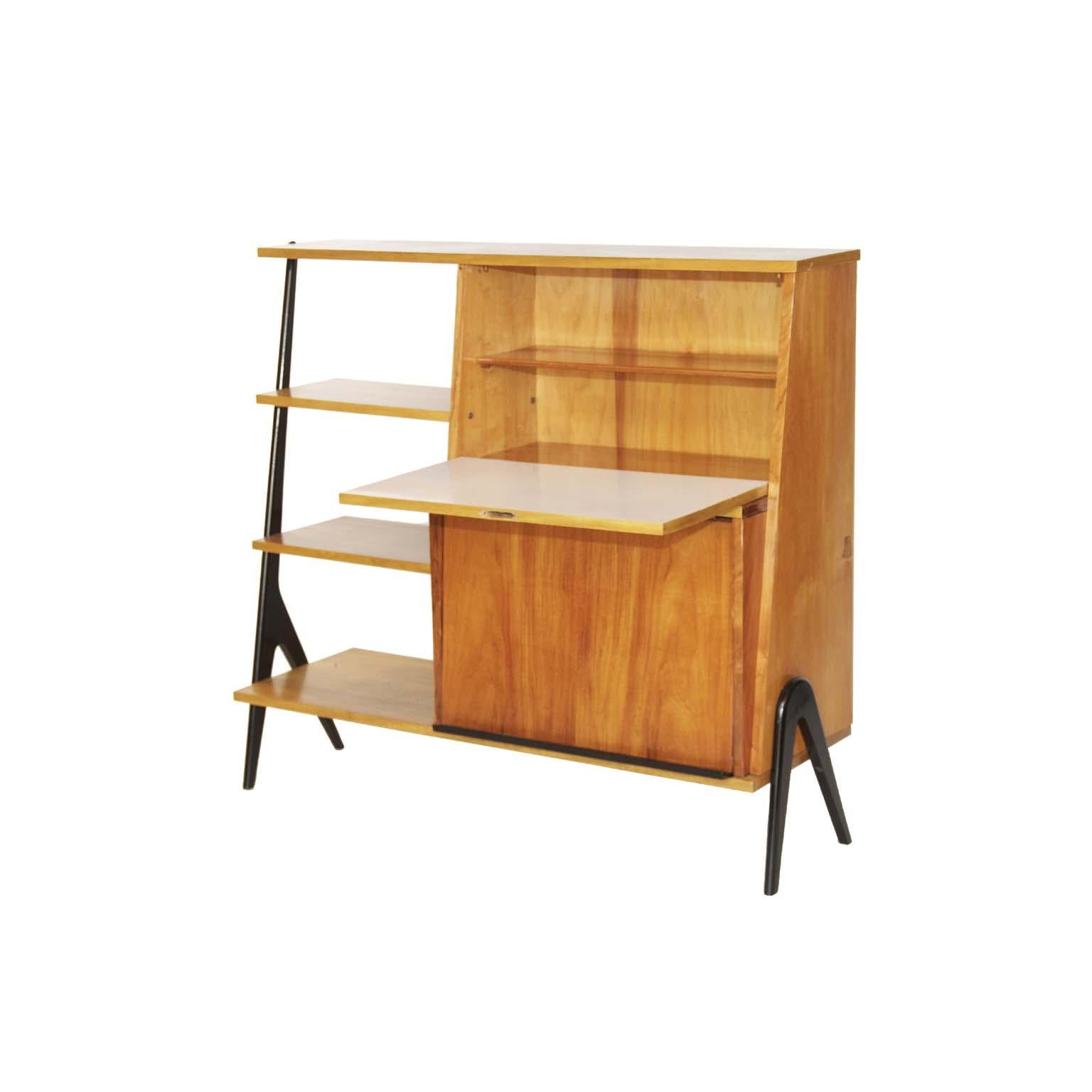 Midcentury Brazilian bookcase with caviúna wood structure, 1960s

In caviúna wood structure, this bookcase has two storage spaces with doors. One of the doors becomes an artboard for small jobs. Its black feet give the highlight in every beauty of