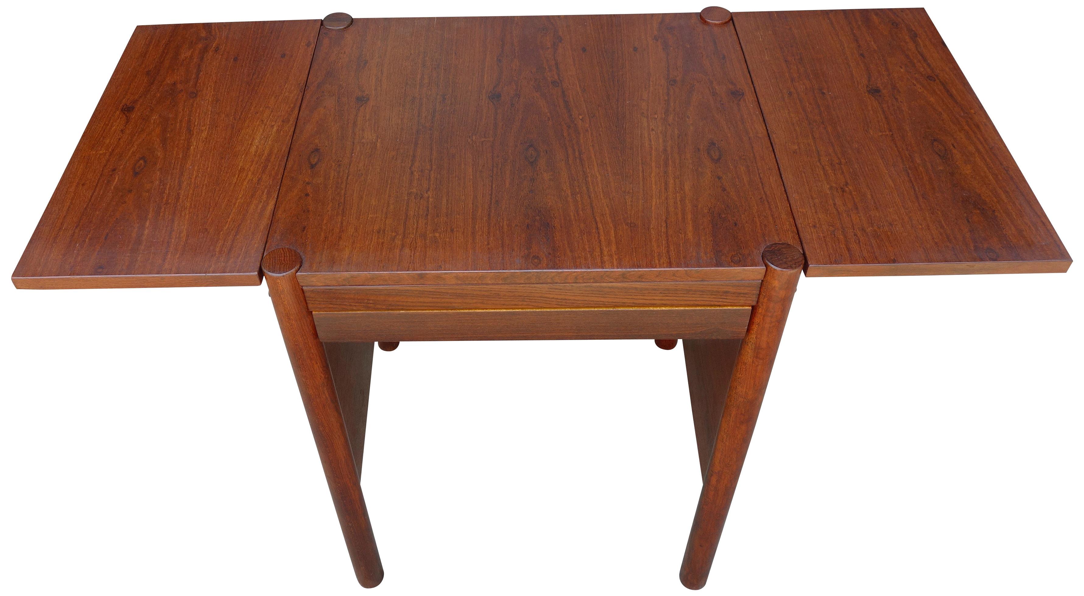 For your consideration is this fantastic side table or entry way table, or even a small desk by Jean Gillon made of native hardwood Jangada (a type of Bolivian rosewood). Featuring a pullout / pull-out drawer and two drop leaves. Each leaf measuring