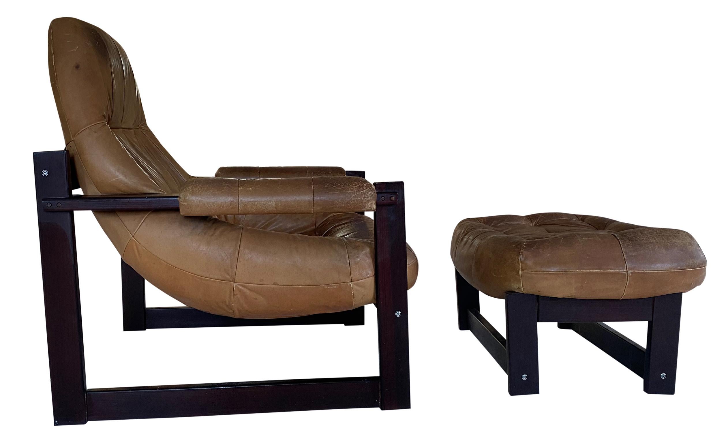 Midcentury Brazilian Leather lounge chair by Percival Lafer Brazilian with ottoman. Great lounge chair made out of solid rosewood and leather. This Lounge is all original vintage condition with lots of beautiful Patina use wear to the leather