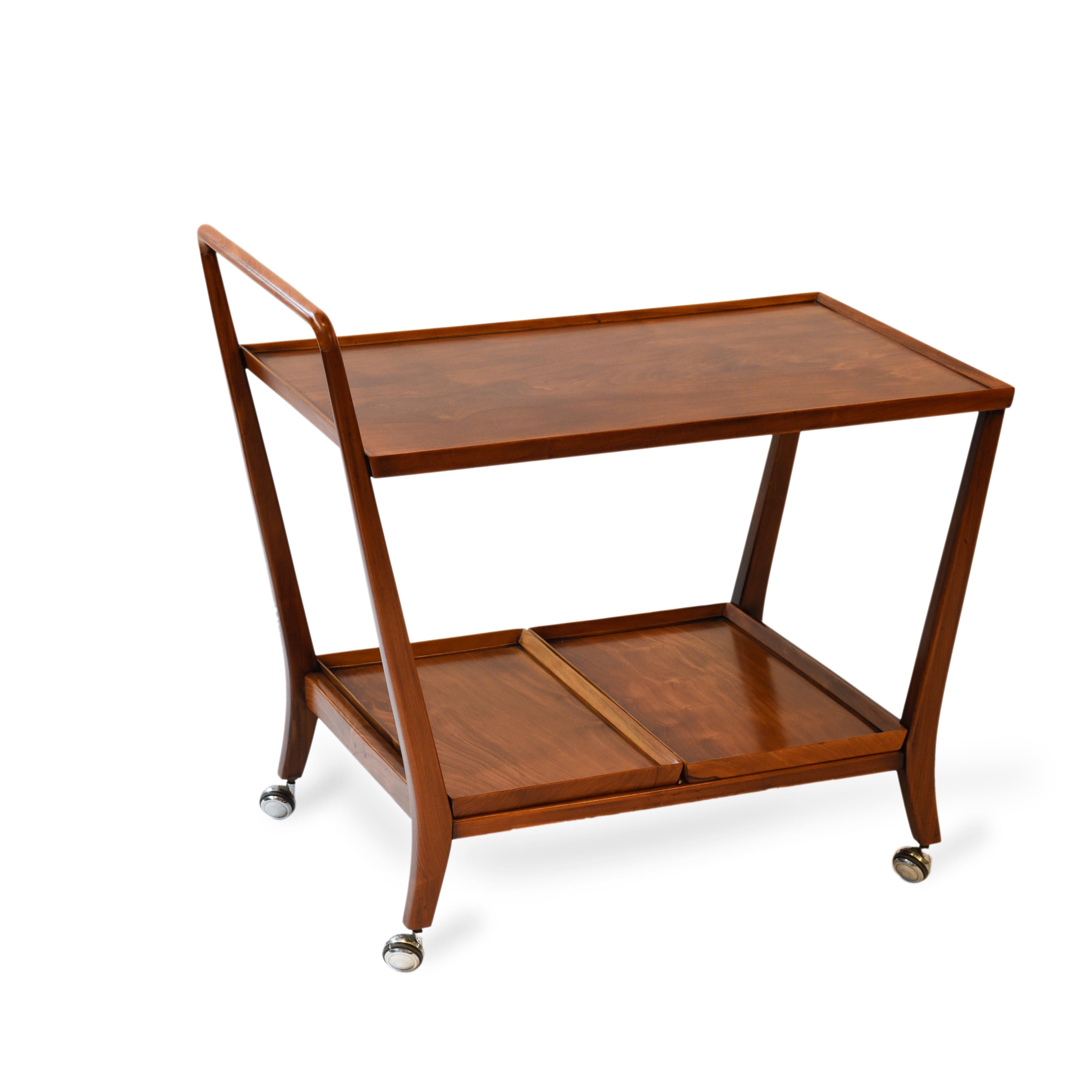 Midcentury Brazilian teacart in caviúna wood, 1960s.

Versatile tea cart built in wood caviúna. Its lower trays can be removed and used to serve the drinks.
     
