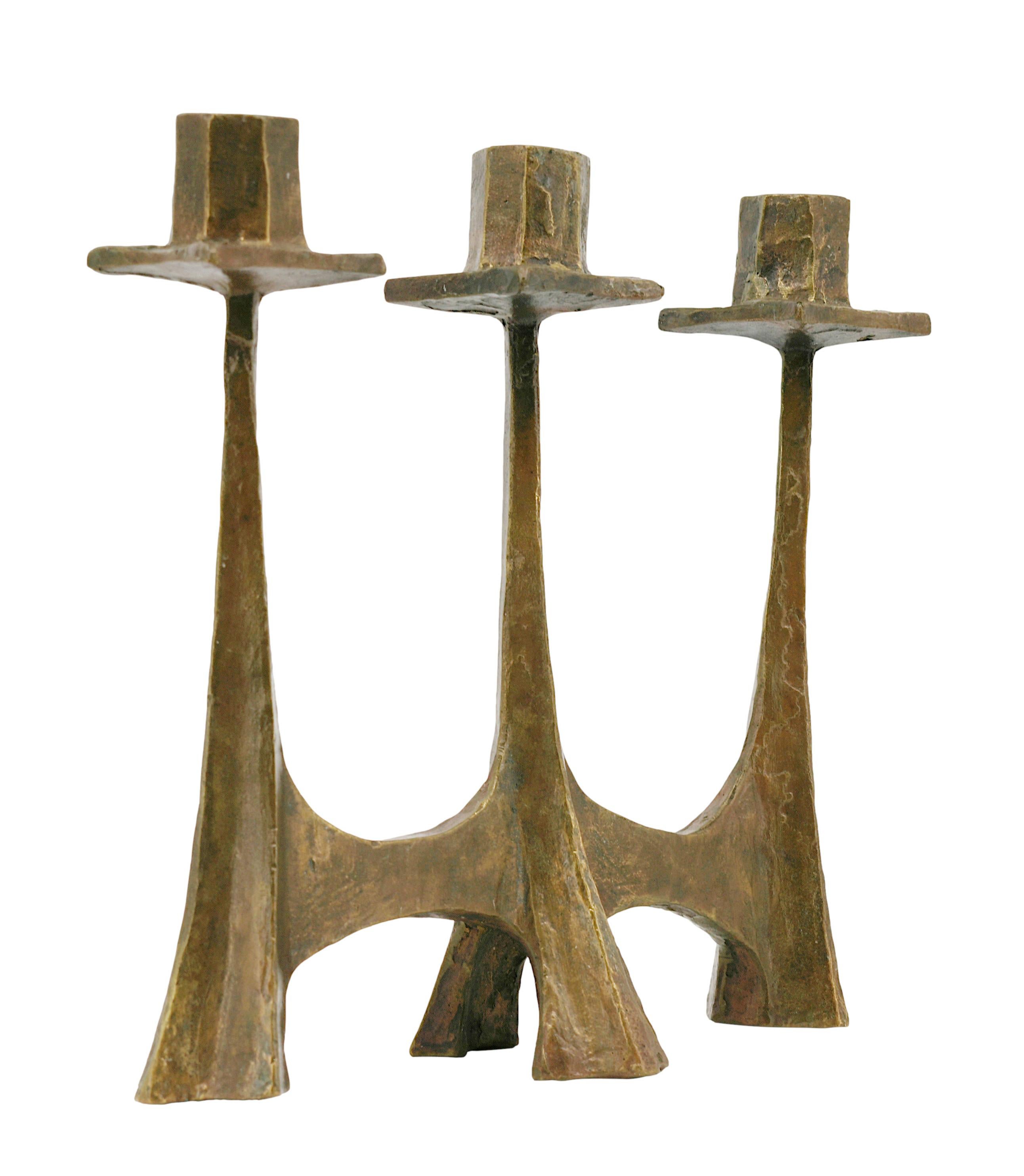 French Midcentury bronze candelabra in the taste of  Ateliers de Marolles, France, ca.1950. Liturgical candelabra of raw and rustic shape in the style of the Ateliers de Marolles. Height : 10.2