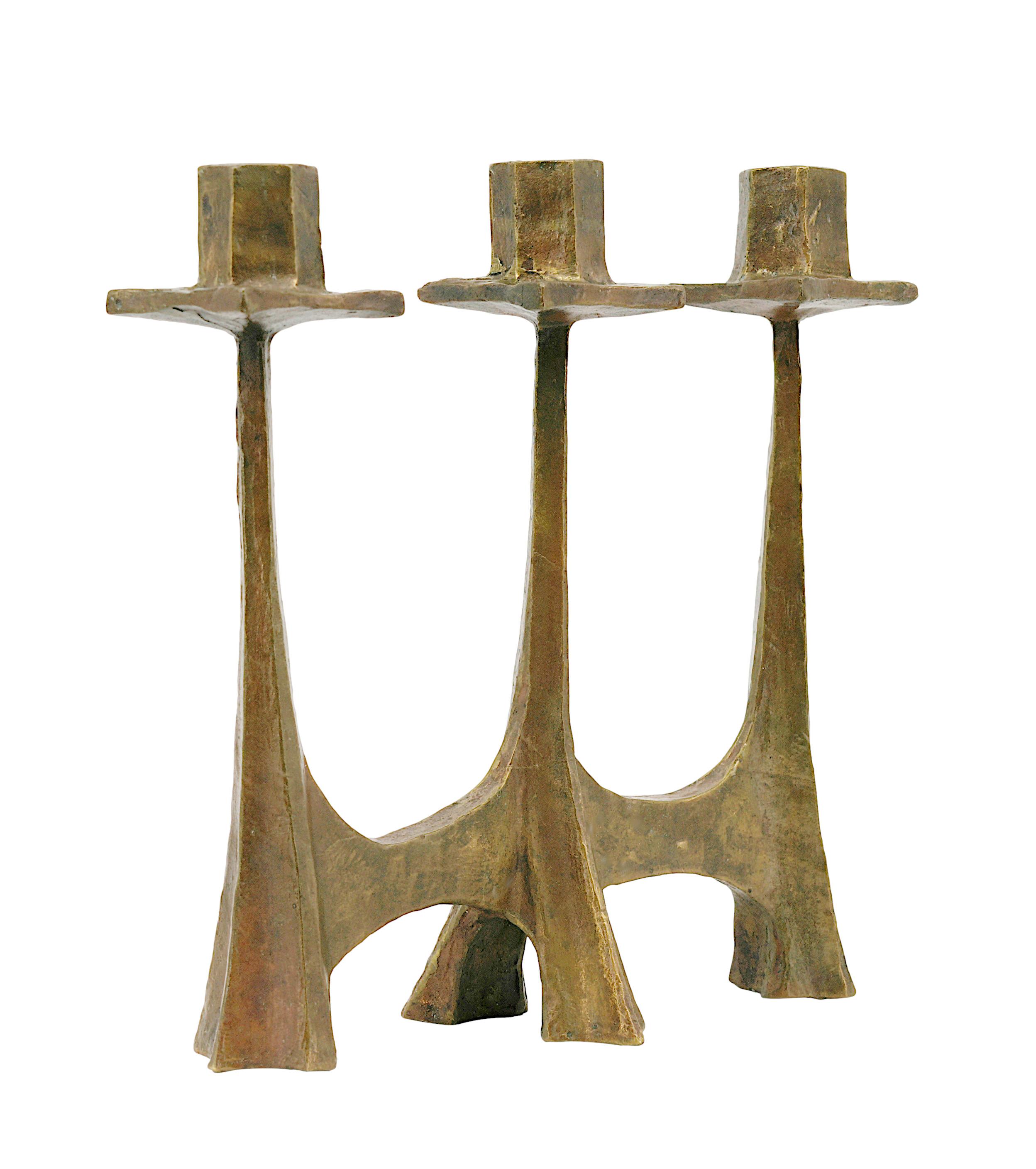 French Midcentury bronze candelabra in the taste of  Ateliers de Marolles, France, ca.1950. Liturgical candelabra of raw and rustic shape in the style of the Ateliers de Marolles. Height : 10.2
