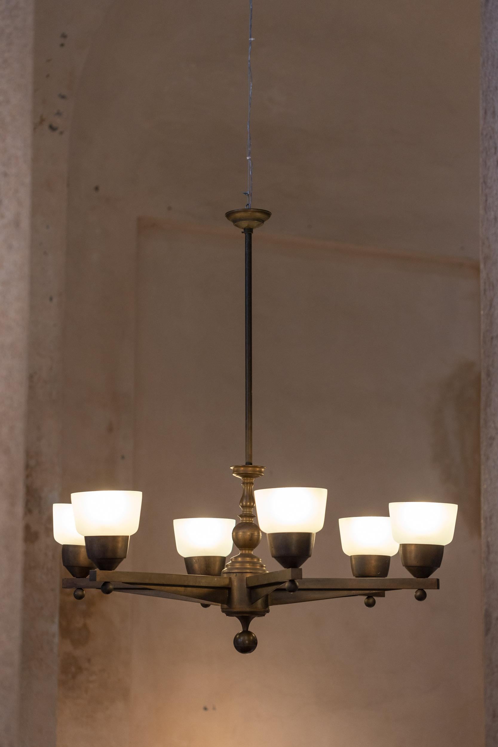 stunning six arms bronzr chandelier.
Original bronze structure with beautiful vintage patina. 
Each arm has its light with hand blown light blue Murano glass lampshade
by Venini

Italy 1930 c.