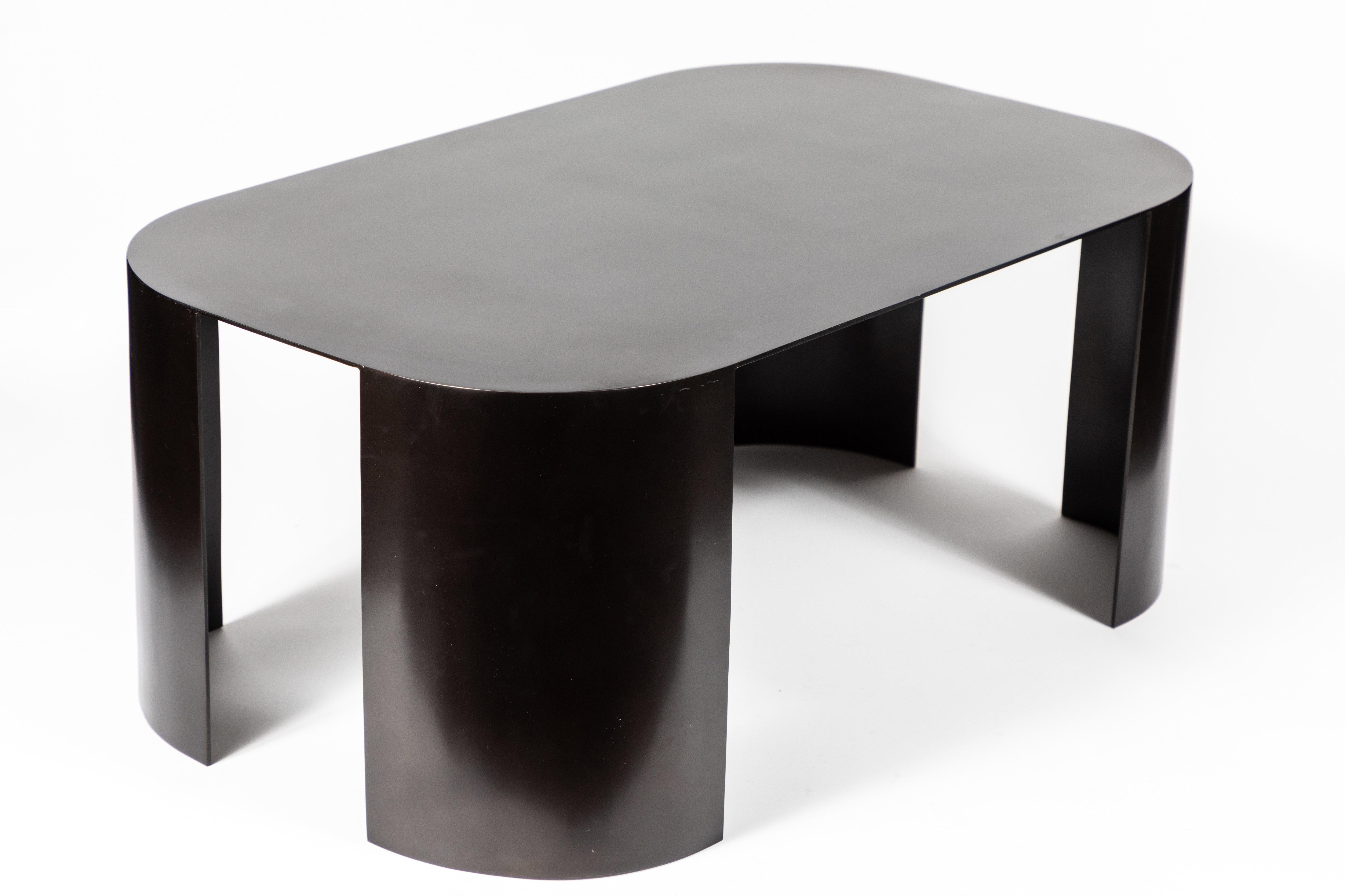 Beautiful coffee table in bronze-plated steel in the manner of Karl Springer. The table's clean lines and size make it a versatile piece in many spaces.