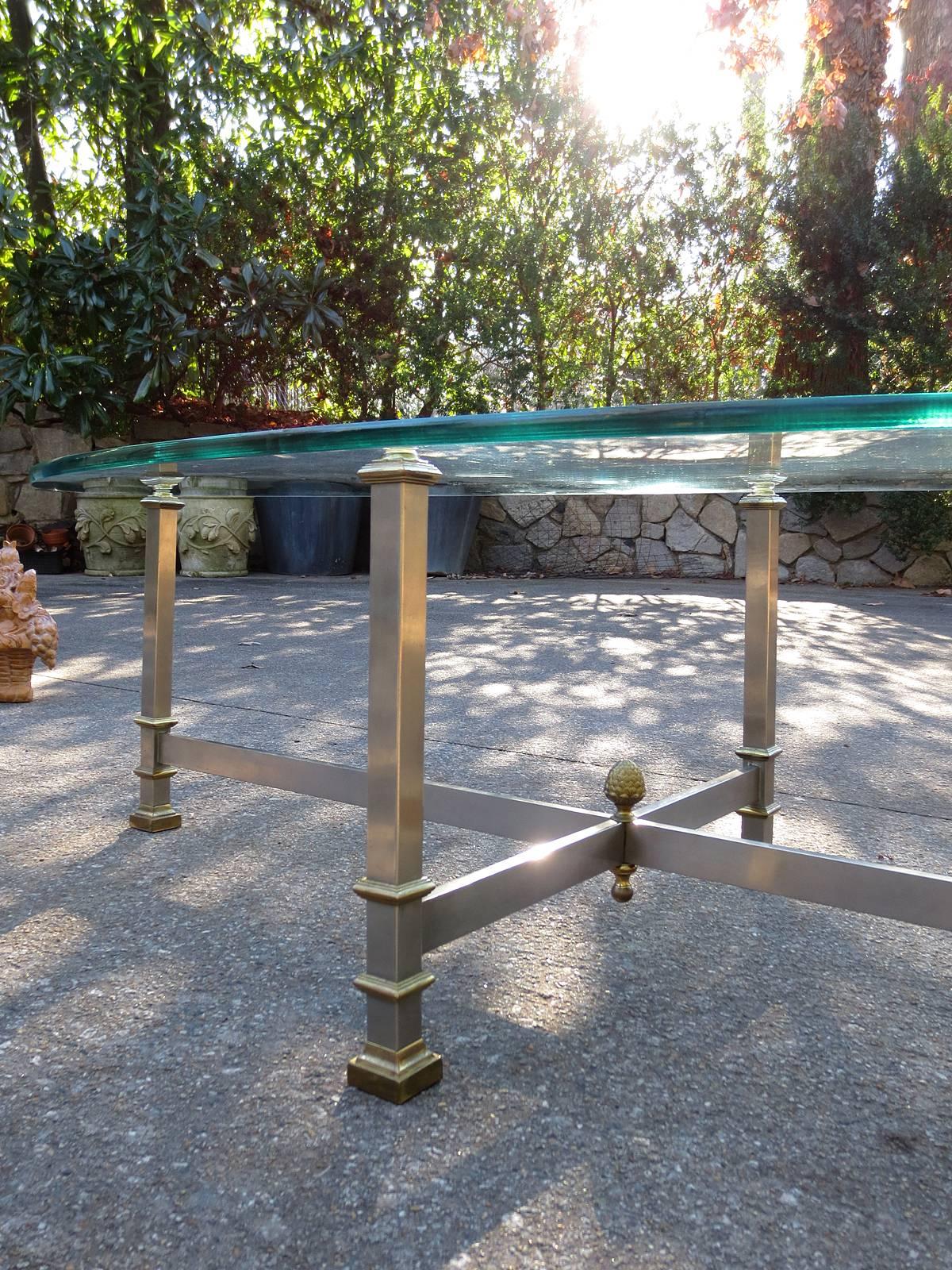 Mid-20th Century bronze coffee table with glass top.