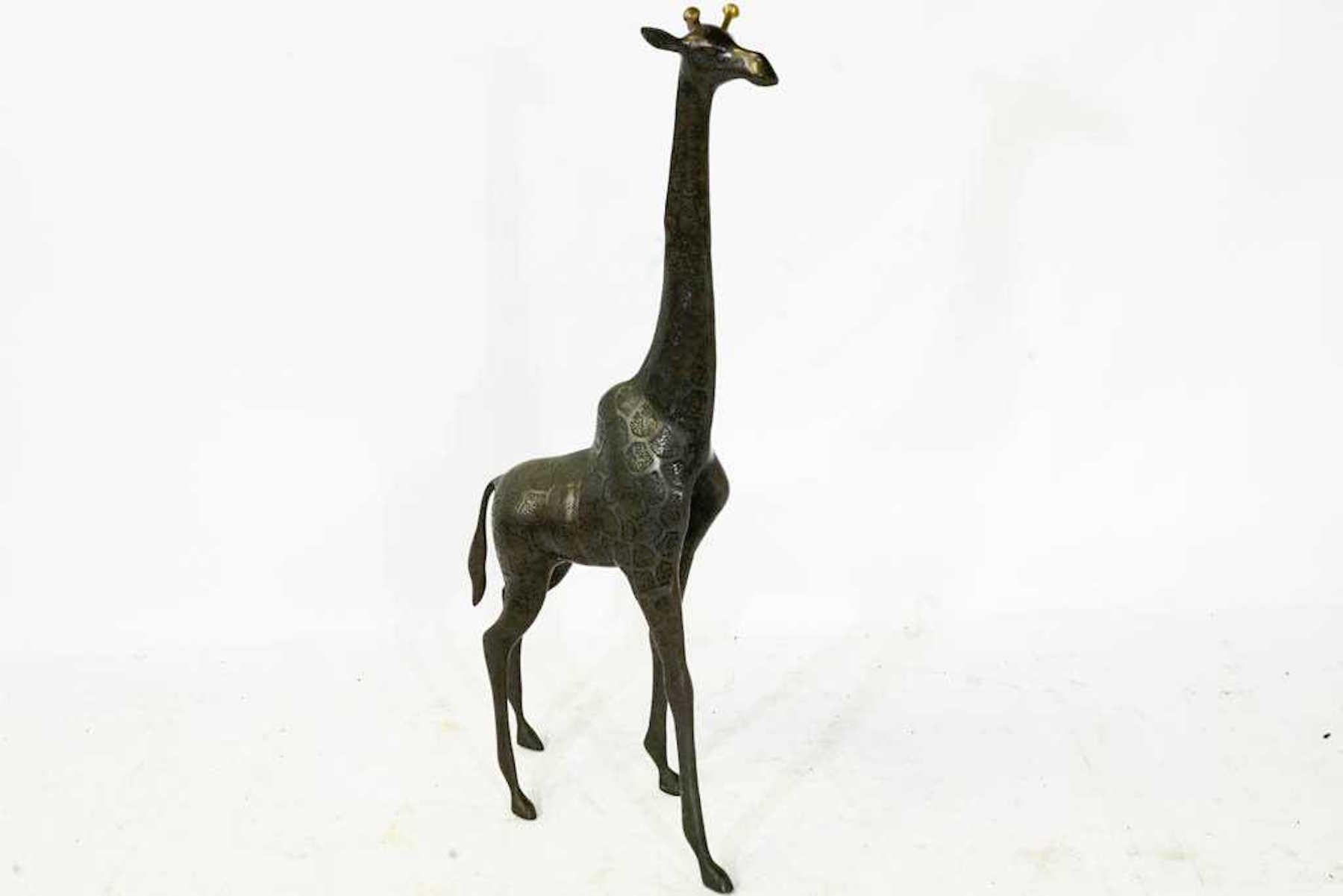 Midcentury bronze sculpture of a giraffe, well cast and modeled with an expressive face.