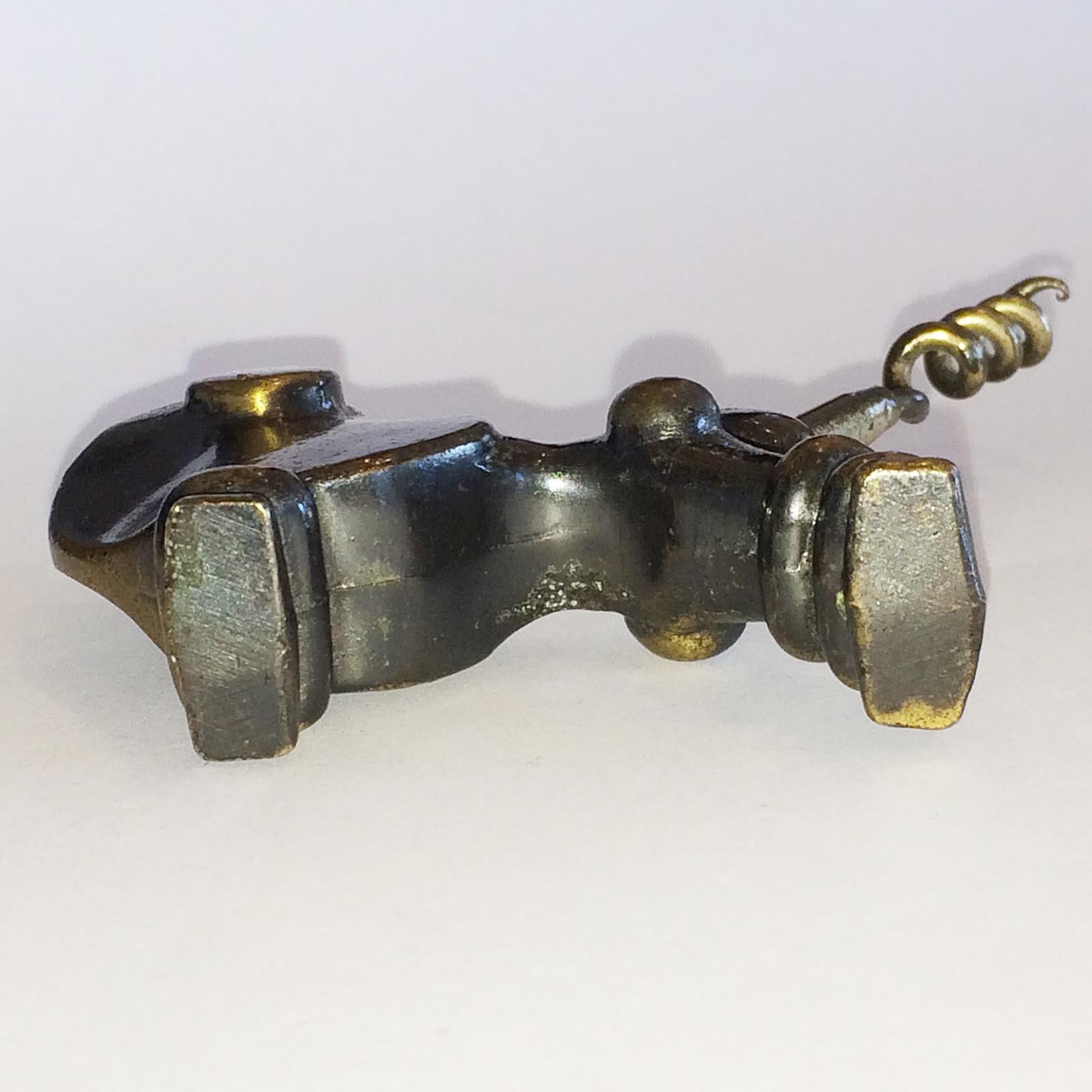 Midcentury unusual corkscrew with bronzed, stylized and geometric poodle with hand-forged screw to tail. The poodle is in a “japanned” finish with black and bronze glaze. General aged patina according to age, but in excellent, strong condition with