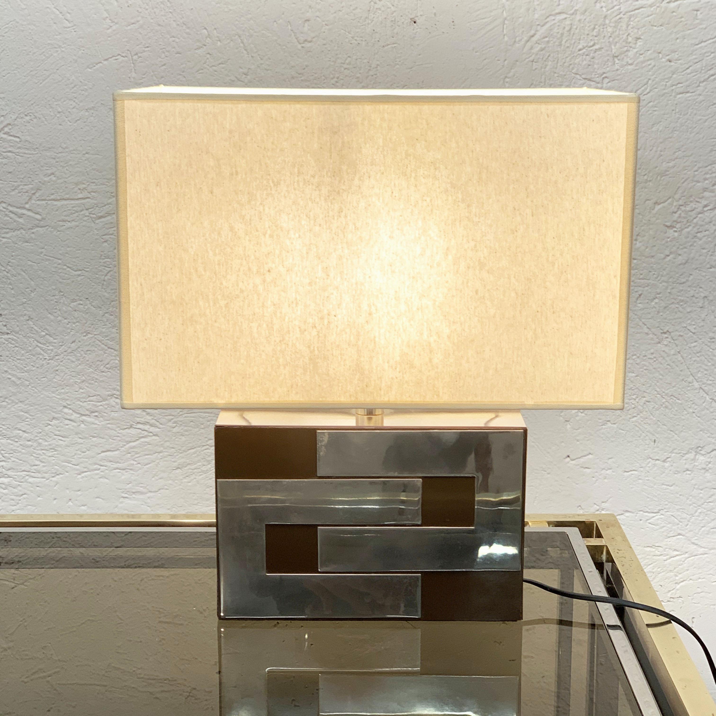 Incredible midcentury brown Formica and chrome in Willy Rizzo style.

This amazing table lamp was produced in France during 1970s and is in original vintage condition. It is made of a block of Formica and metal and an elegant with fabric