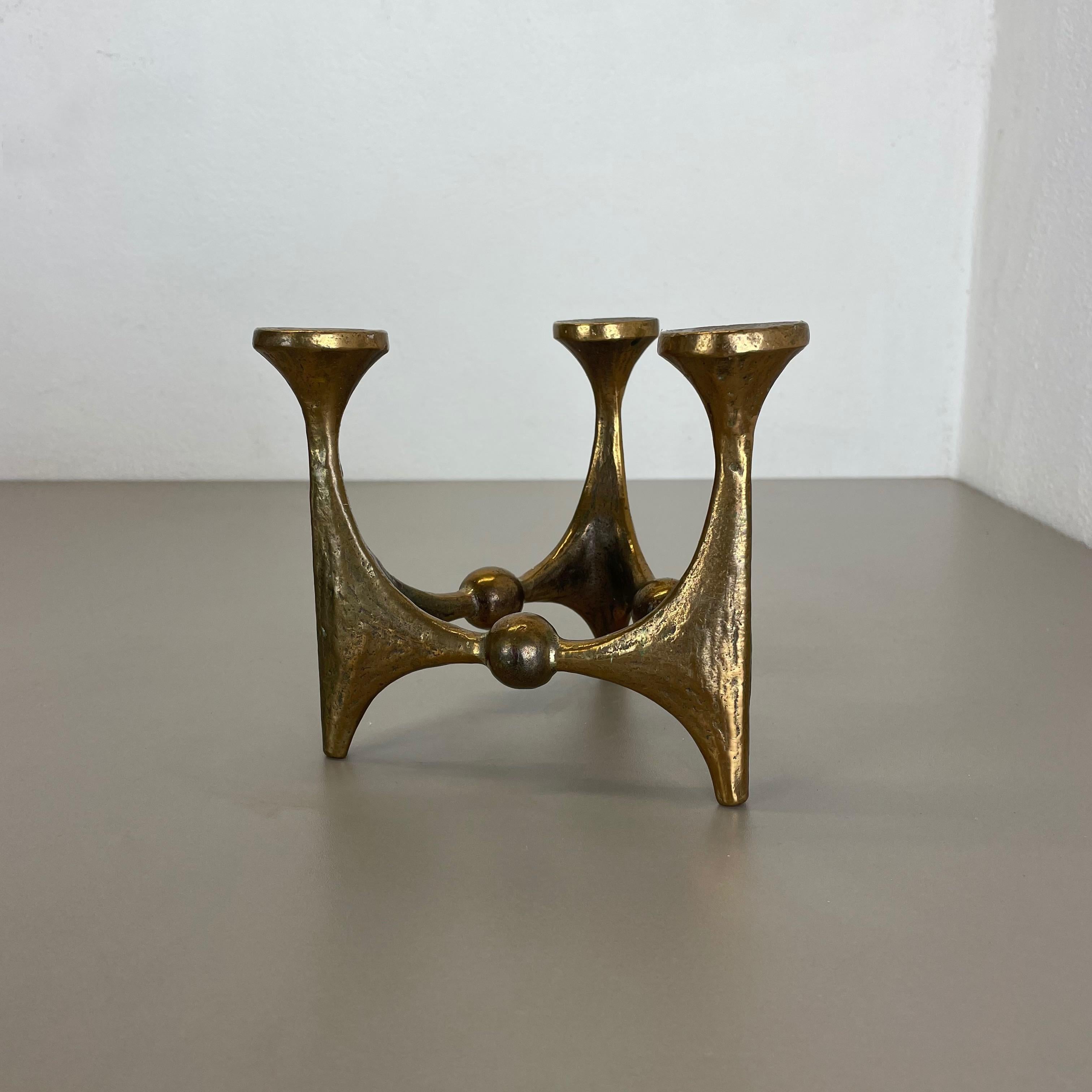 Article: Brutalist candleholder

Origin: Germany

Design producer: Michael Harjes

Material: bronze

Decade: 1960s

Description: This original vintage candleholder, was produced in the 1960s in Germany. Designed and executed by Michael