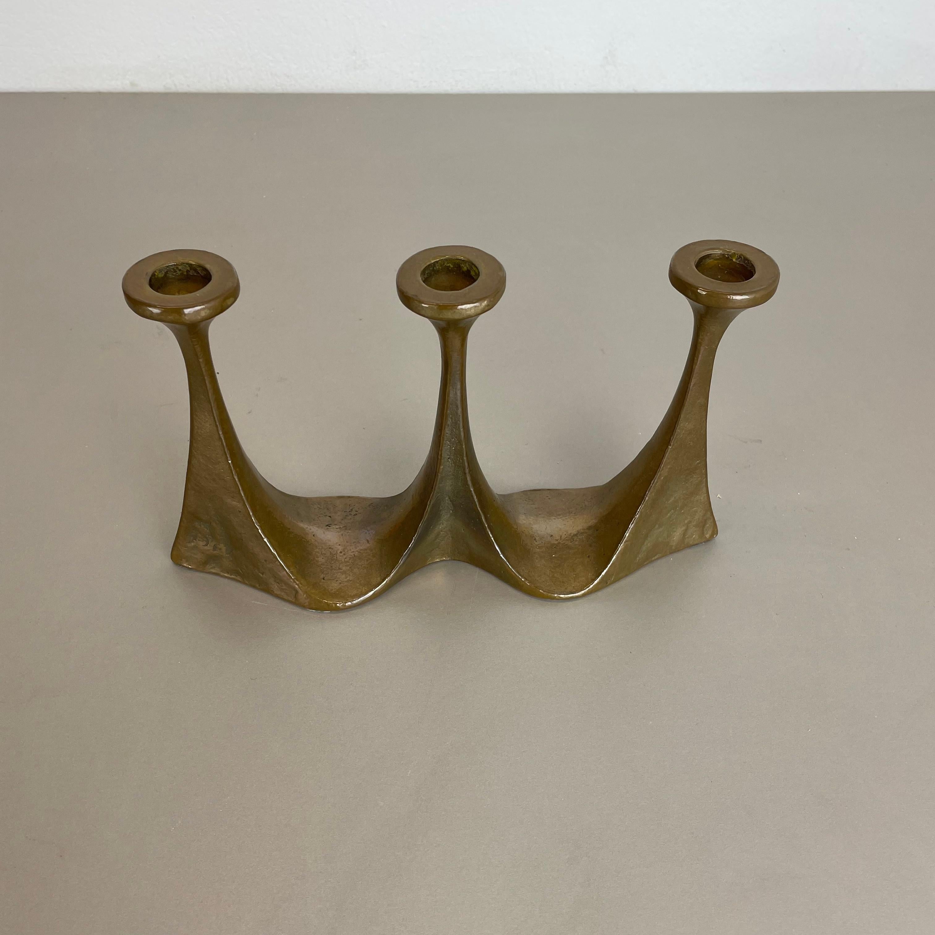 Article: Brutalist candleholder

Origin: Germany

Design producer: Michael Harjes

Material: bronze

Decade: 1960s

Description: This original vintage candleholder was produced in the 1960s in Germany. Designed and executed by Michael
