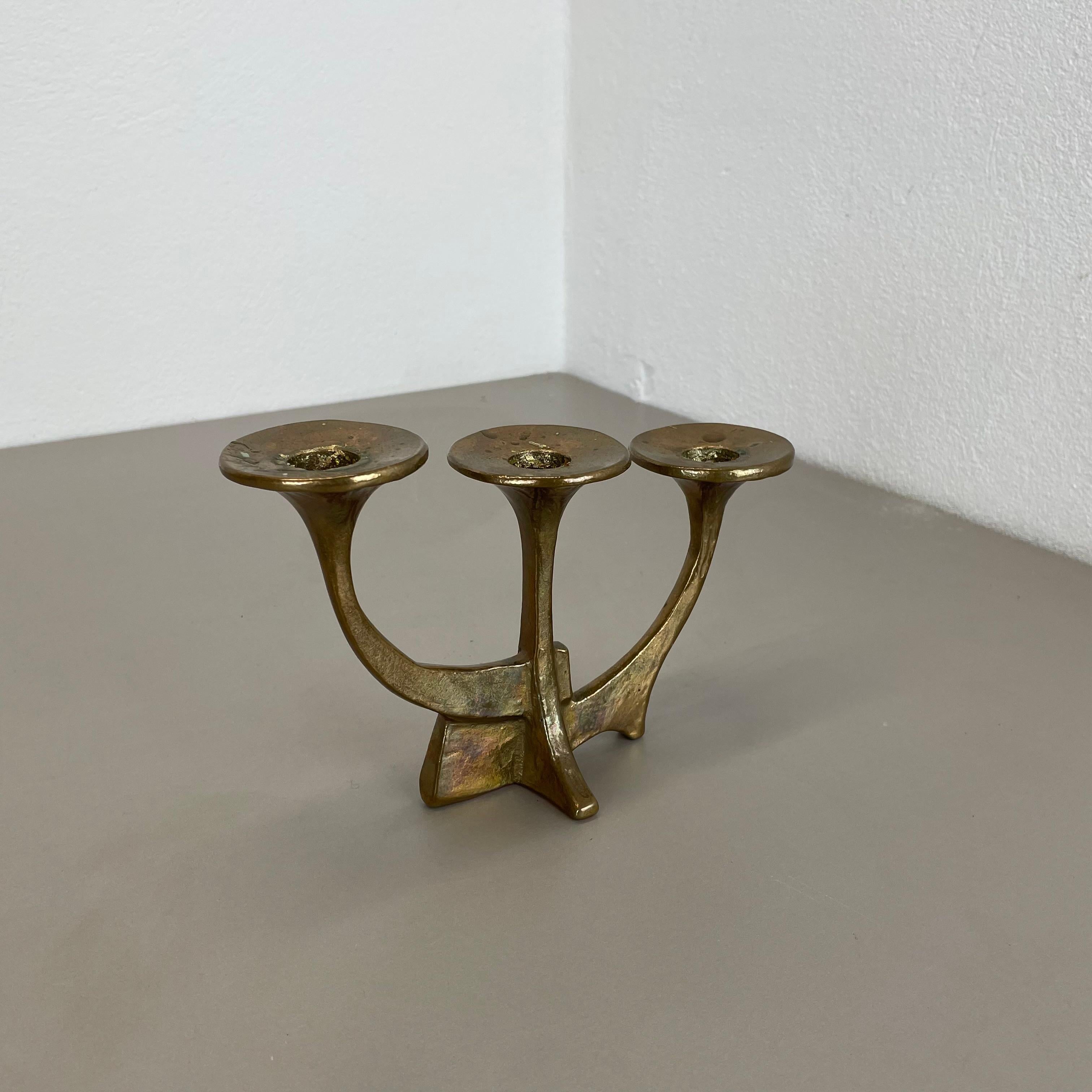 Article: Brutalist candleholder

Origin: Germany

Design producer: Michael Harjes

Material: bronze

Decade: 1960s

Description: This original vintage candleholder was produced in the 1960s in Germany. Designed and executed by Michael Harjes,