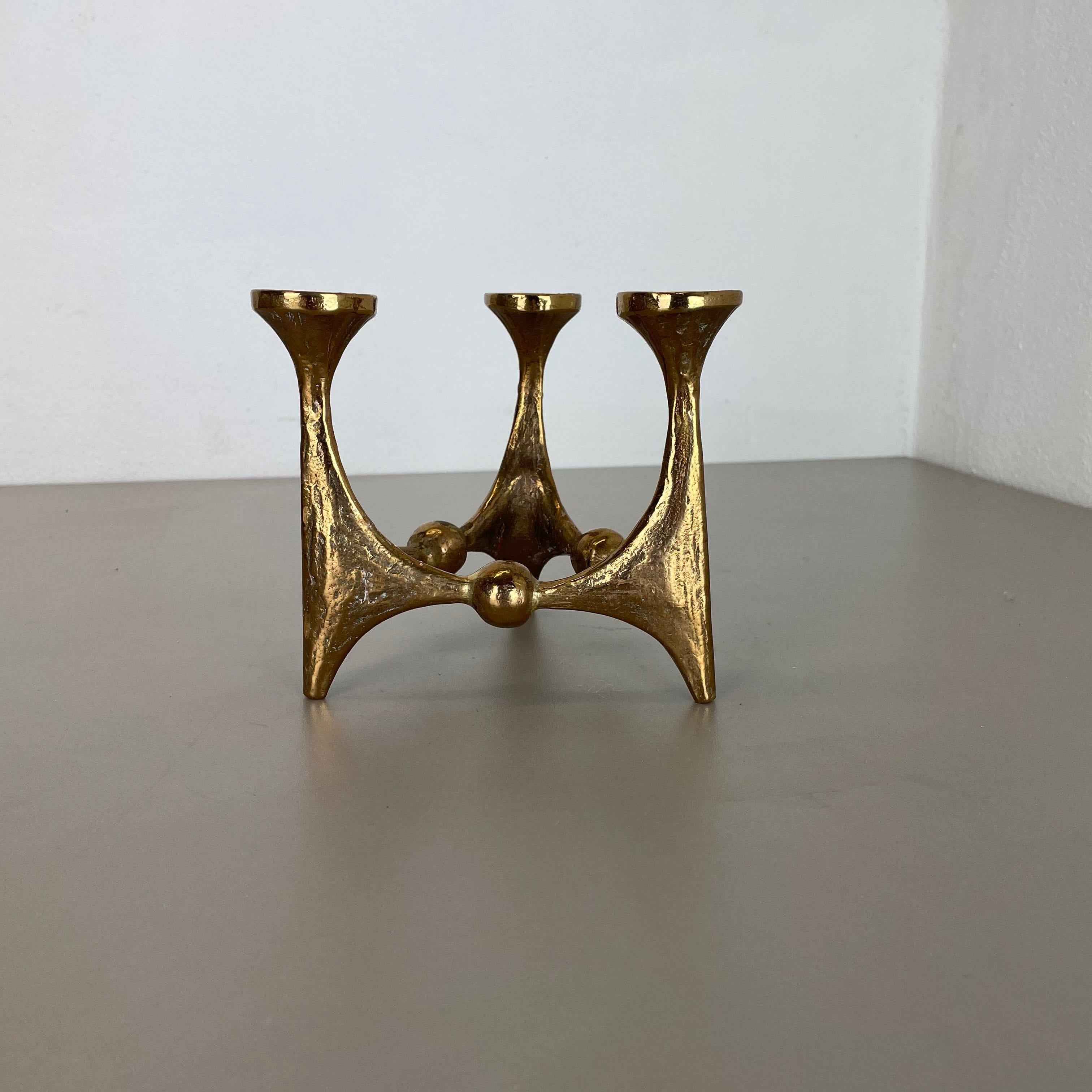 Article: Brutalist candleholder

Origin: Germany

Design producer: Michael Harjes

Material: bronze

Decade: 1960s

Description: This original vintage candleholder, was produced in the 1960s in Germany. Designed and executed by Michael
