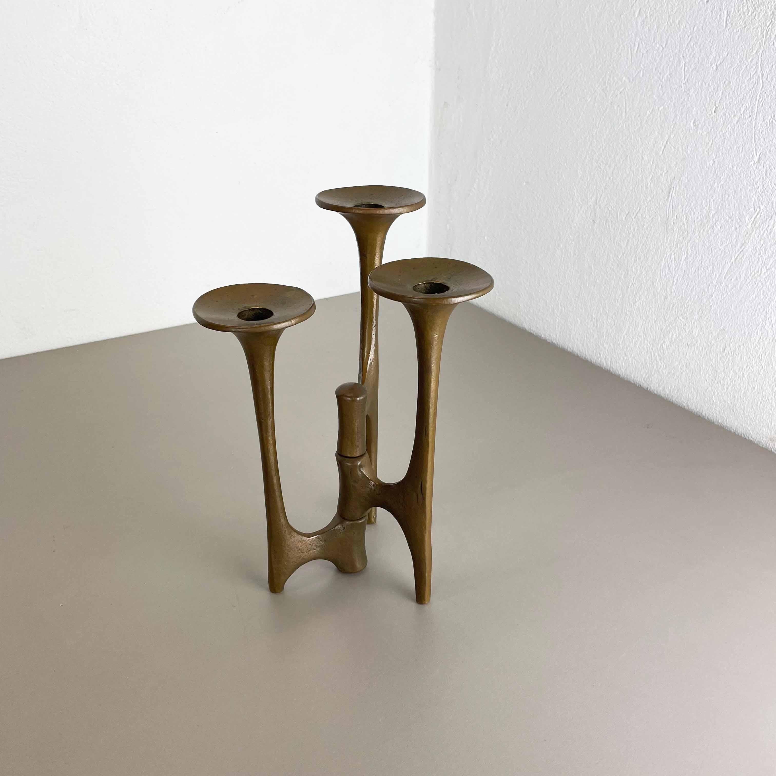 Article: Brutalist candleholder

Origin: Germany

Design producer: Michael Harjes

Material: bronze

Decade: 1960s

Description: This original vintage candleholder, was produced in the 1960s in Germany. Designed and executed by Michael