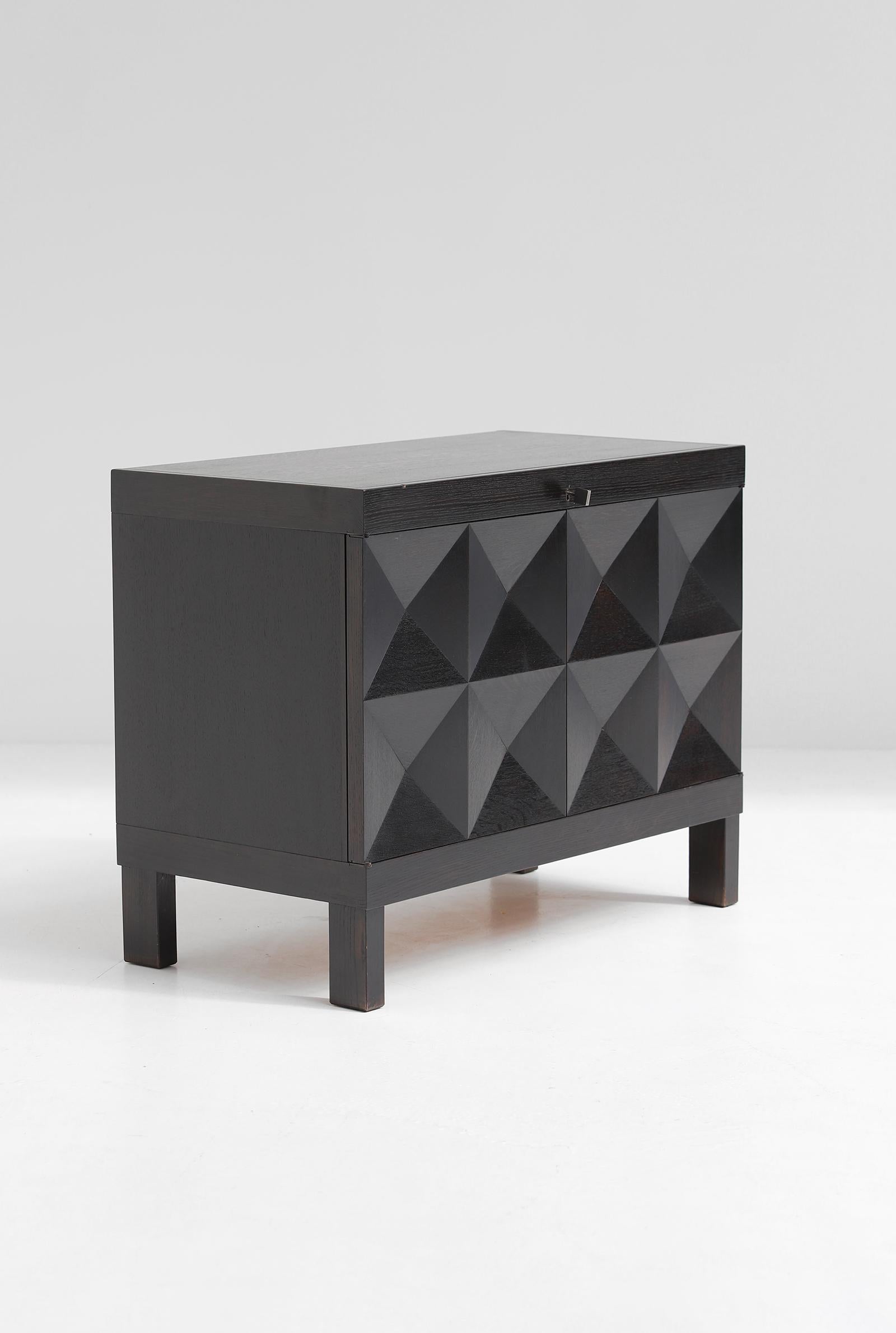 Brutalist cabinet designed by Jean Batenburg for MI, Belgium. The cabinet was designed in 1969 and only produced for a few years. Some dealers do sell this as a product from De Coene, although they cannot provide any documentation. Nevertheless