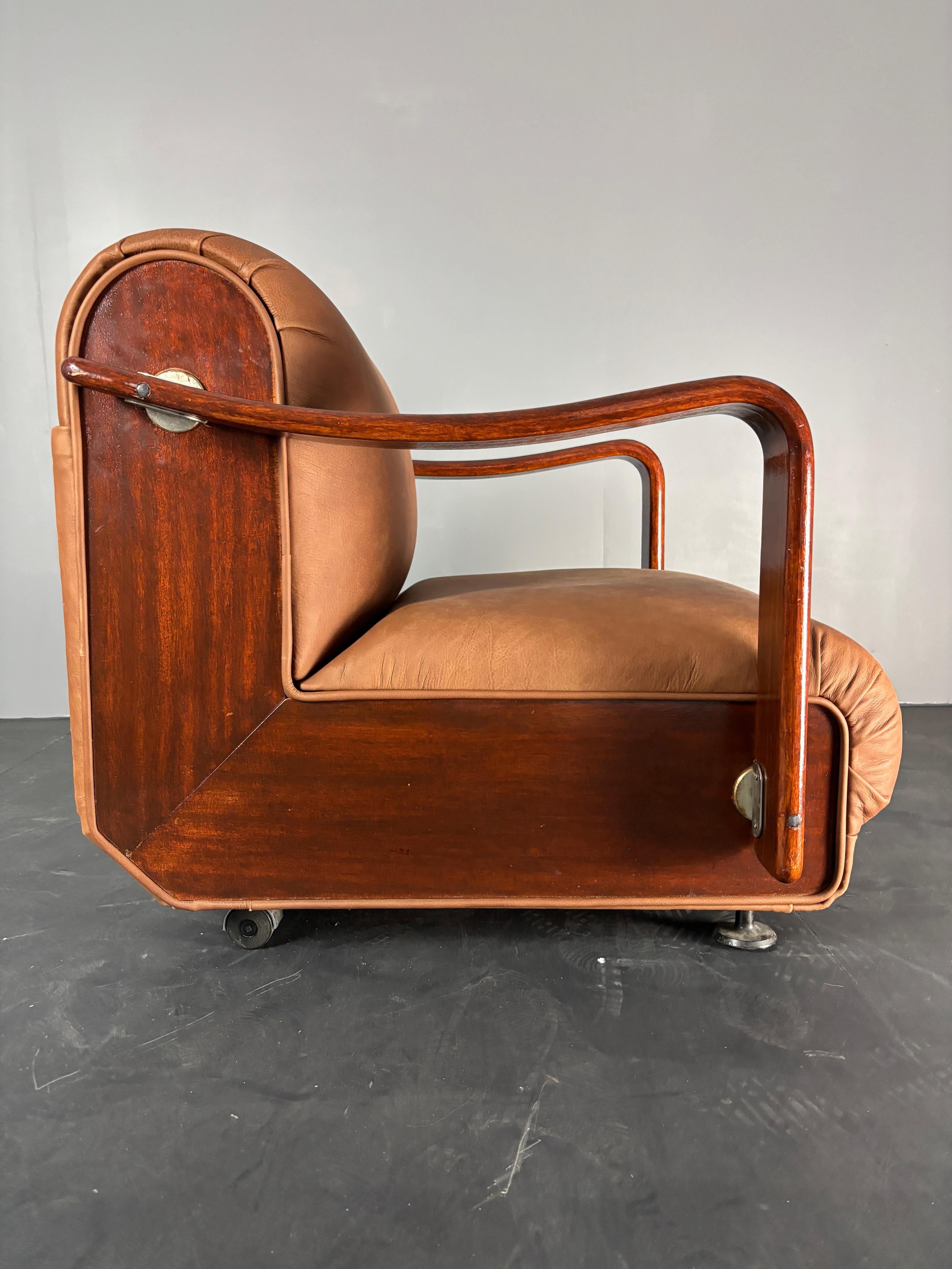 Lovely proportioned club or lounge chair in wood with reupholstered leather. According to the seller it originated form the Czech Republic and was supposedly designed for an embassy or consulate. The chair has two small wheels in the back so easily