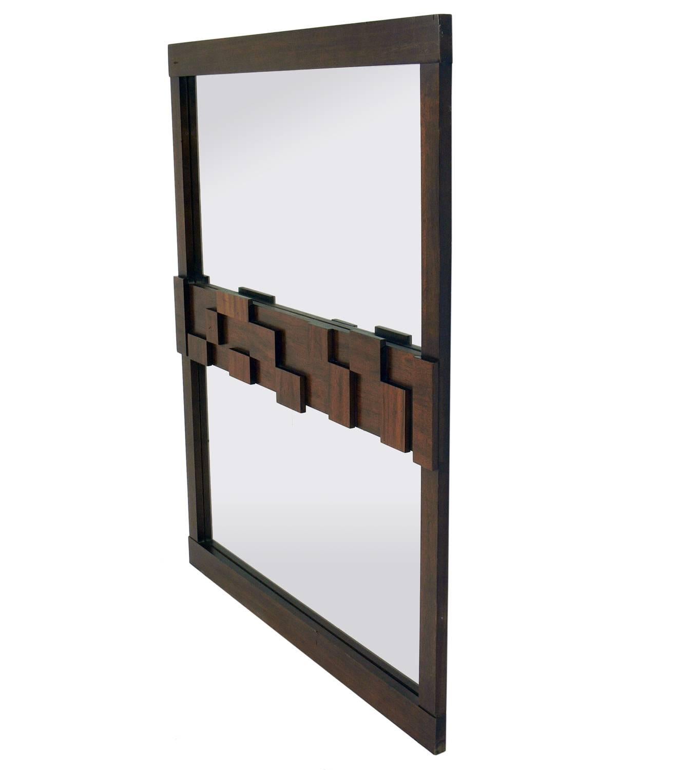 Midcentury Brutalist mirror by Lane, American, circa 1960s. This piece retains it's original medium brown finish. If you prefer, we can refinish it in the color of your choice, including solid lacquer colors like white, for an additional $250.