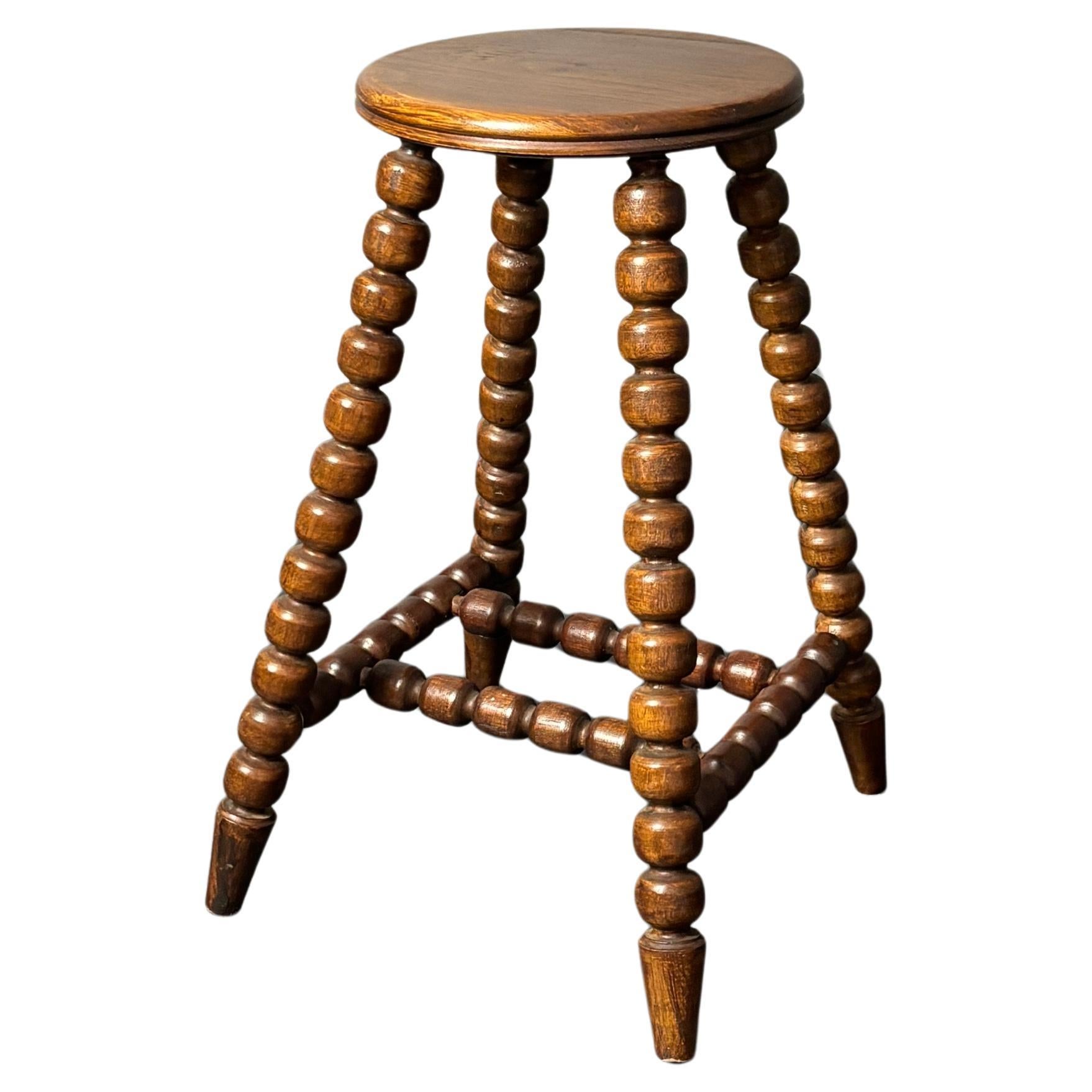 Midcentury brutalist wood turned stool in the style of Charles Dudouyt, 1950s For Sale