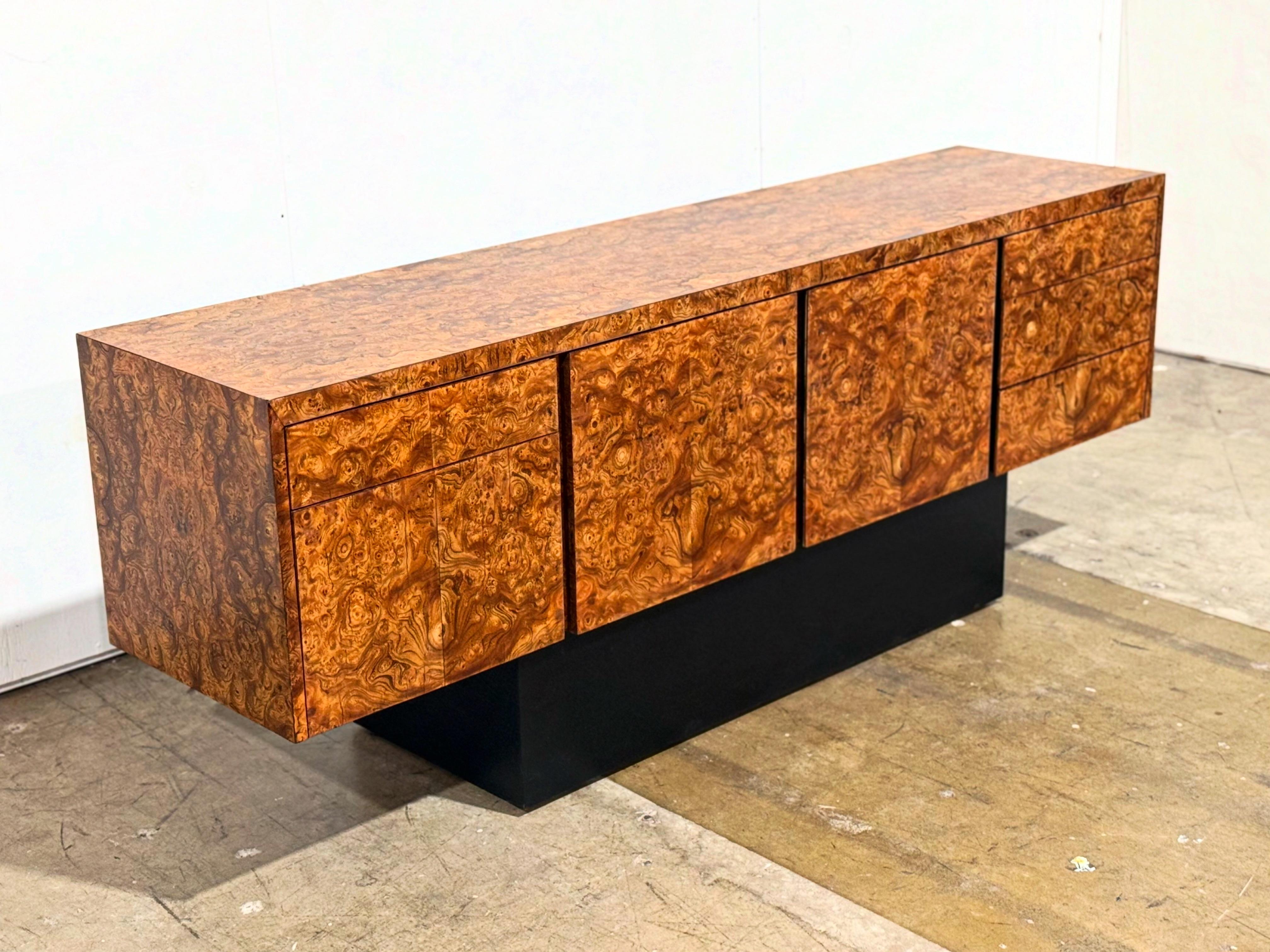 Stunning vintage burled Olivewood credenza by Eppinger, circa 1970s. Eppinger exclusively designed and built C-Suite furniture in the 70s and 80s. Big and bold design with exquisite craftsmanship and materials.
Excellent overall condition - the book