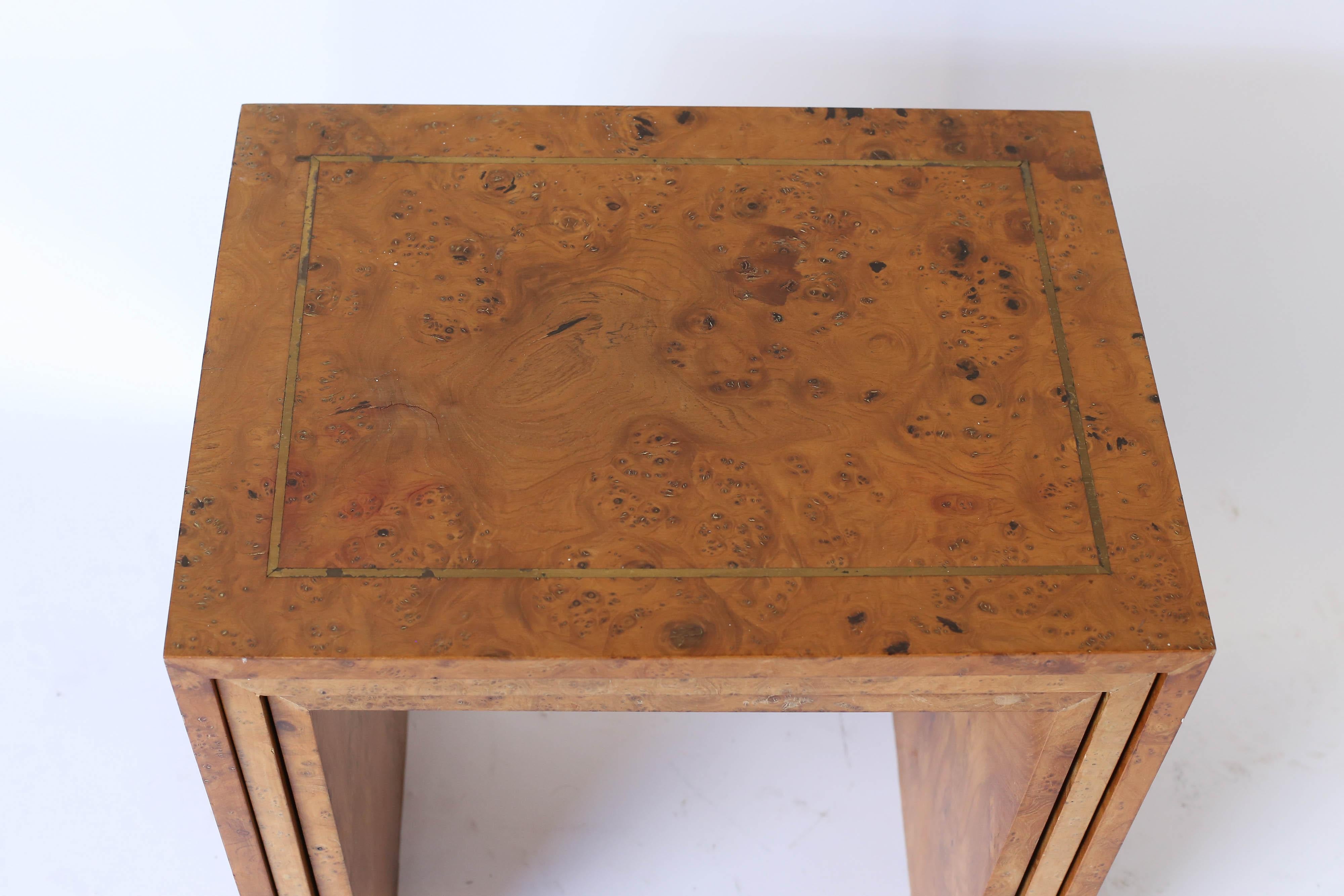 Set of three midcentury burl wood nesting tables with brass inlay. Nestled together the largest table is 19.75