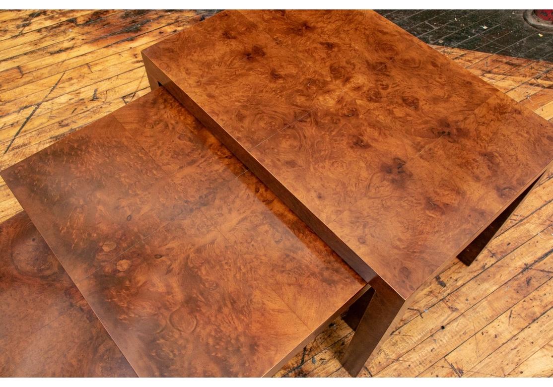 Classic Mid Century Parsons style nesting tables made by Directional in thick burl veneer over solid wood cores. Very well crafted and solid feeling with corner blocking. The tops made in quartered burled sections. Each table has a metal plaque