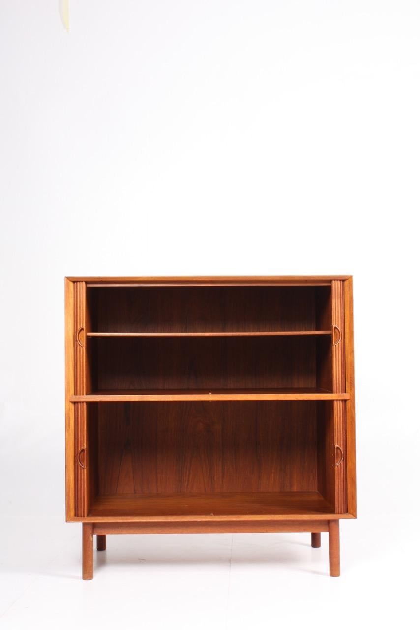 Cabinet in solid teak with tambour doors. Finger- jointed case on round legs. Designed by Hvidt and Mølgaard for Søborg Møbler in 1958. Made in Denmark. Great original condition.