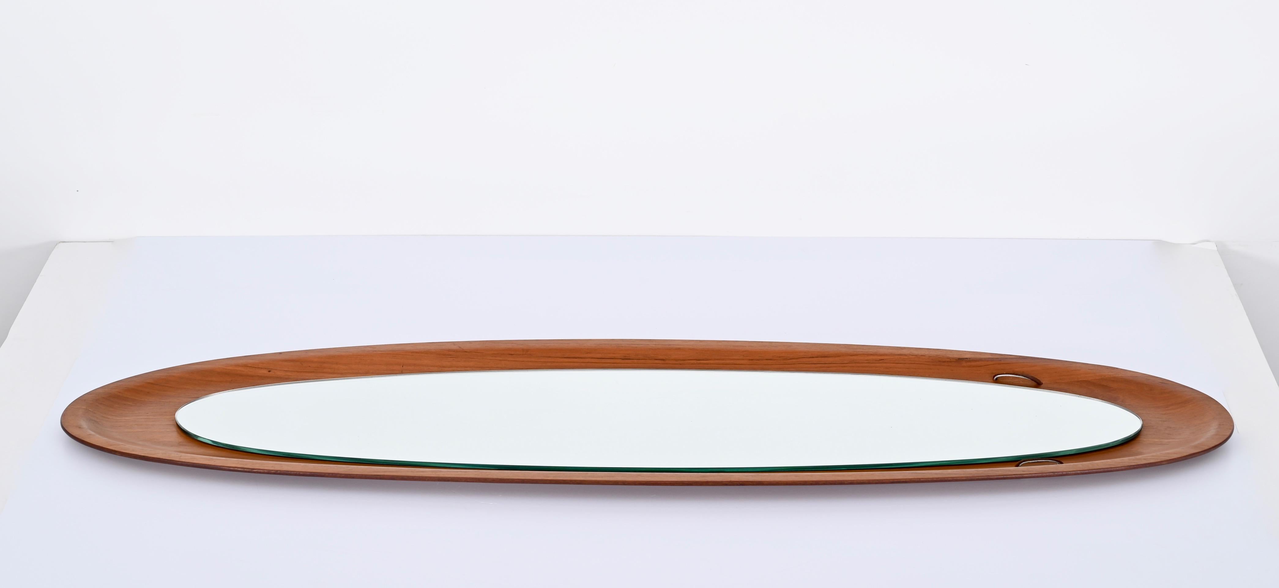 Carved Mid-Century Campo & Graffi Curved Teak Wood Oval Wall Mirror, Italy, 1960s For Sale