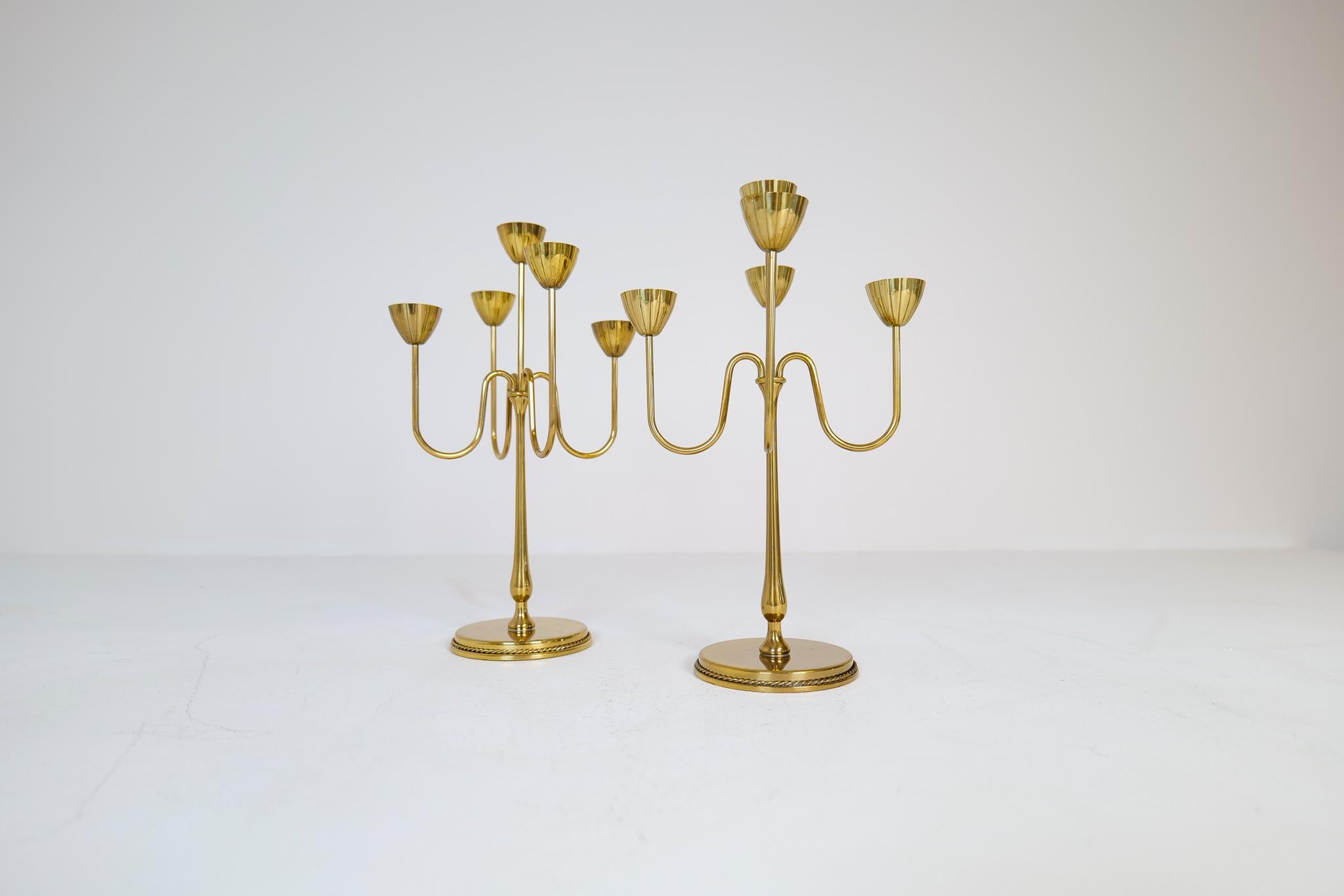 These brass candelabra was made in 1960s at Ystad Metall in Sweden. Designed by Gunnar Ander. Nice, lined brass with holders for small candlesticks.

Good condition with wear of age. 

Dimensions: height: 12.41 in. (32 cm) width: 8.08 in. (21