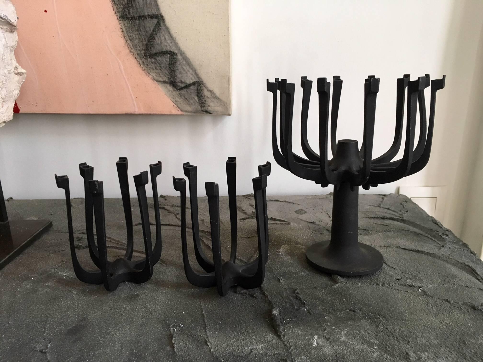Rare midcentury cast zinc candle holder set design by Gunnar Cyren for Dansk.
Likely the most iconic example of Gunnar Cyren’s designs from his tenure at Dansk Designs, this Vintage Original, 12-arm, AGLOW Candelabra with pedestal base .The patina
