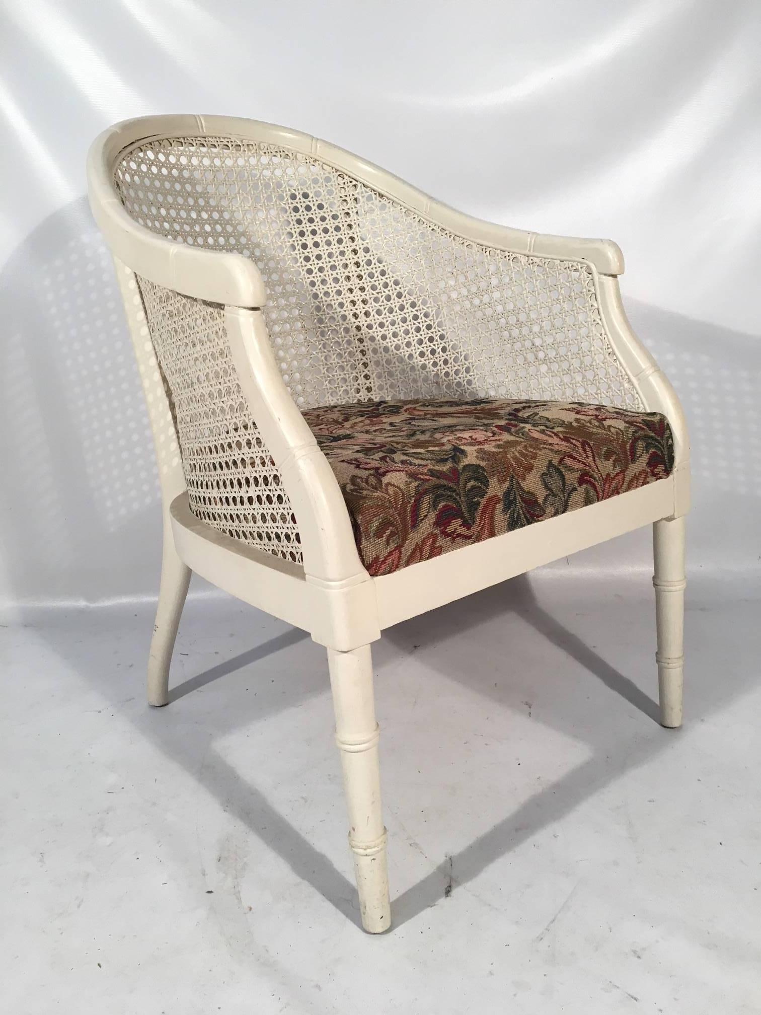 Set of four midcentury caned barrel chairs in excellent vintage condition. Caning in very good condition with only minor wear consistent with age. Off-white finish in very good condition. Structurally sound. Fabric in near perfect condition.