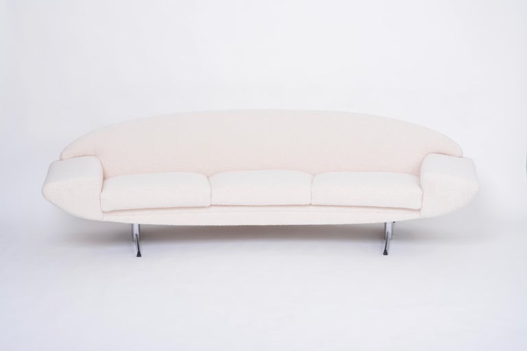 This is an absolute iconic piece of Scandinavian Midcentury Modern design. Johannes Andersen designed the Capri series consisting of a sofa, armchairs and a coffee table all produced by Swedish company Trensum. 
The sofa is is especially beautiful