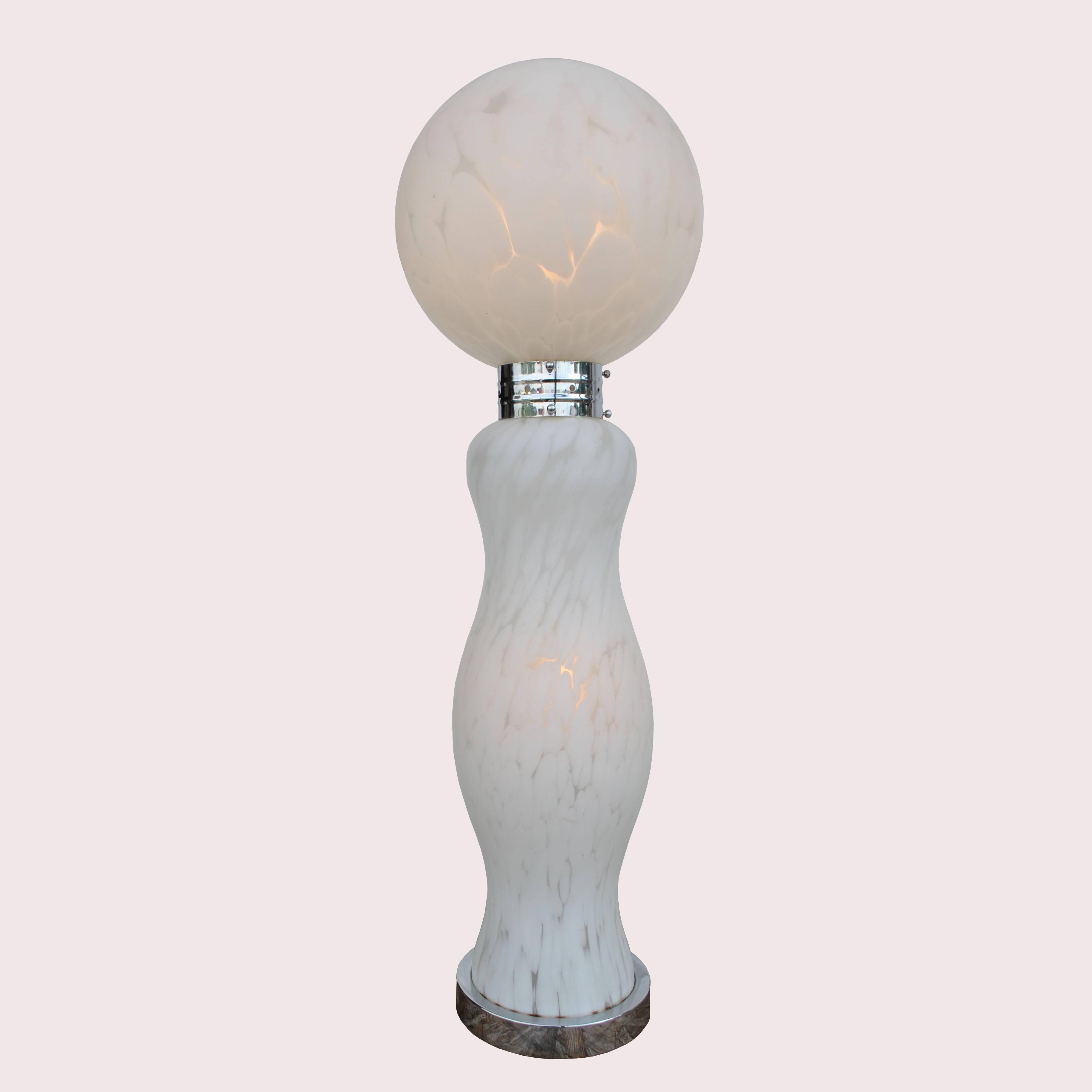 Carlo Nason Mazzega Murano white glass and chrome lamp 
1970s 


A stunning two-piece vintage hand blown glass table or floor lamp from Italy. The white swirls of glass give a dramatic look when lit or unlit.
The sculptural base is joined by a