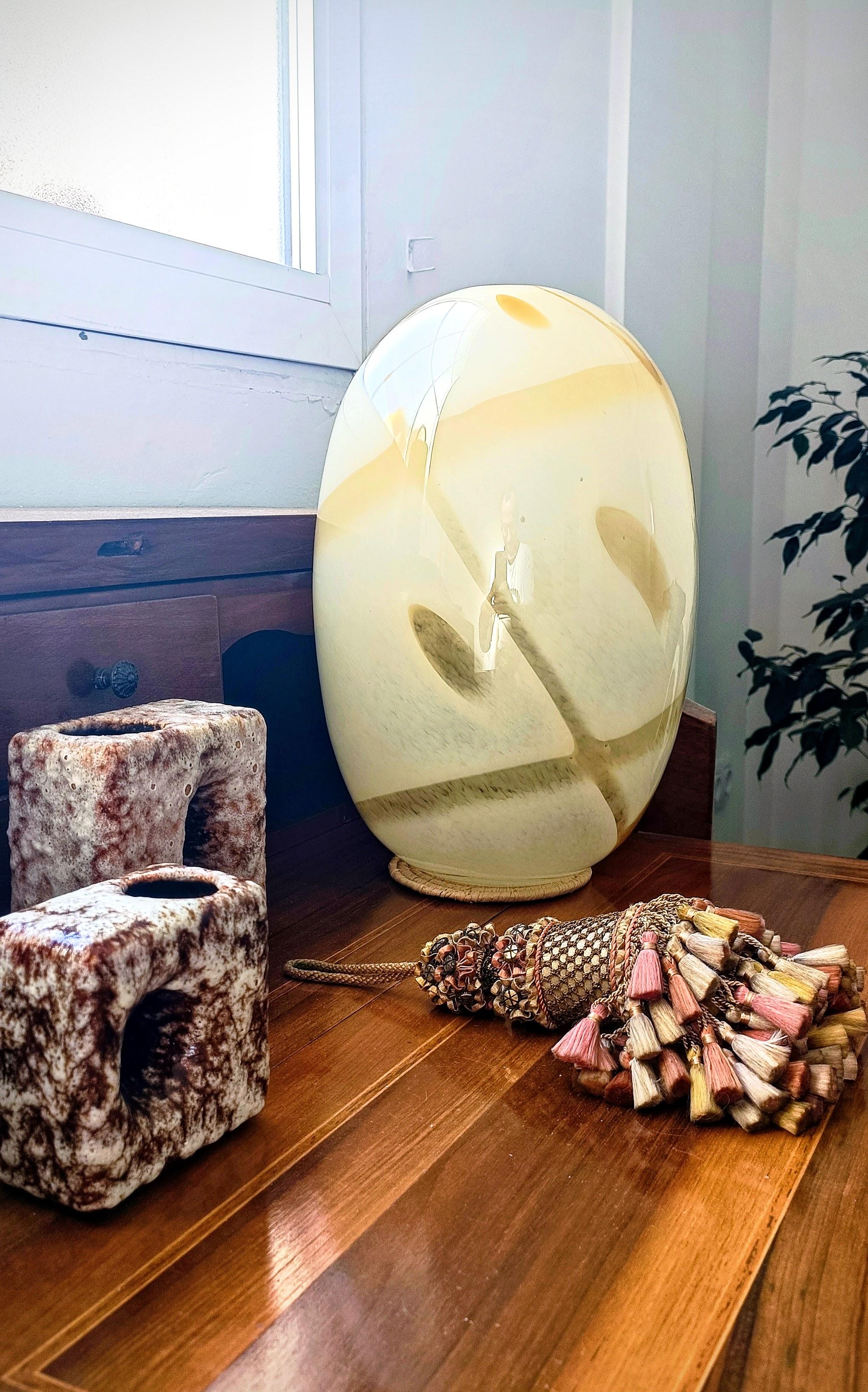 This Murano glass vase, designed by the renowned architect and designer Carlo Scarpa for Venini, exemplifies the mastery of mid-century Italian glassmaking. Hand-blown in the 1960s, the piece reflects Scarpa’s deep understanding of traditional