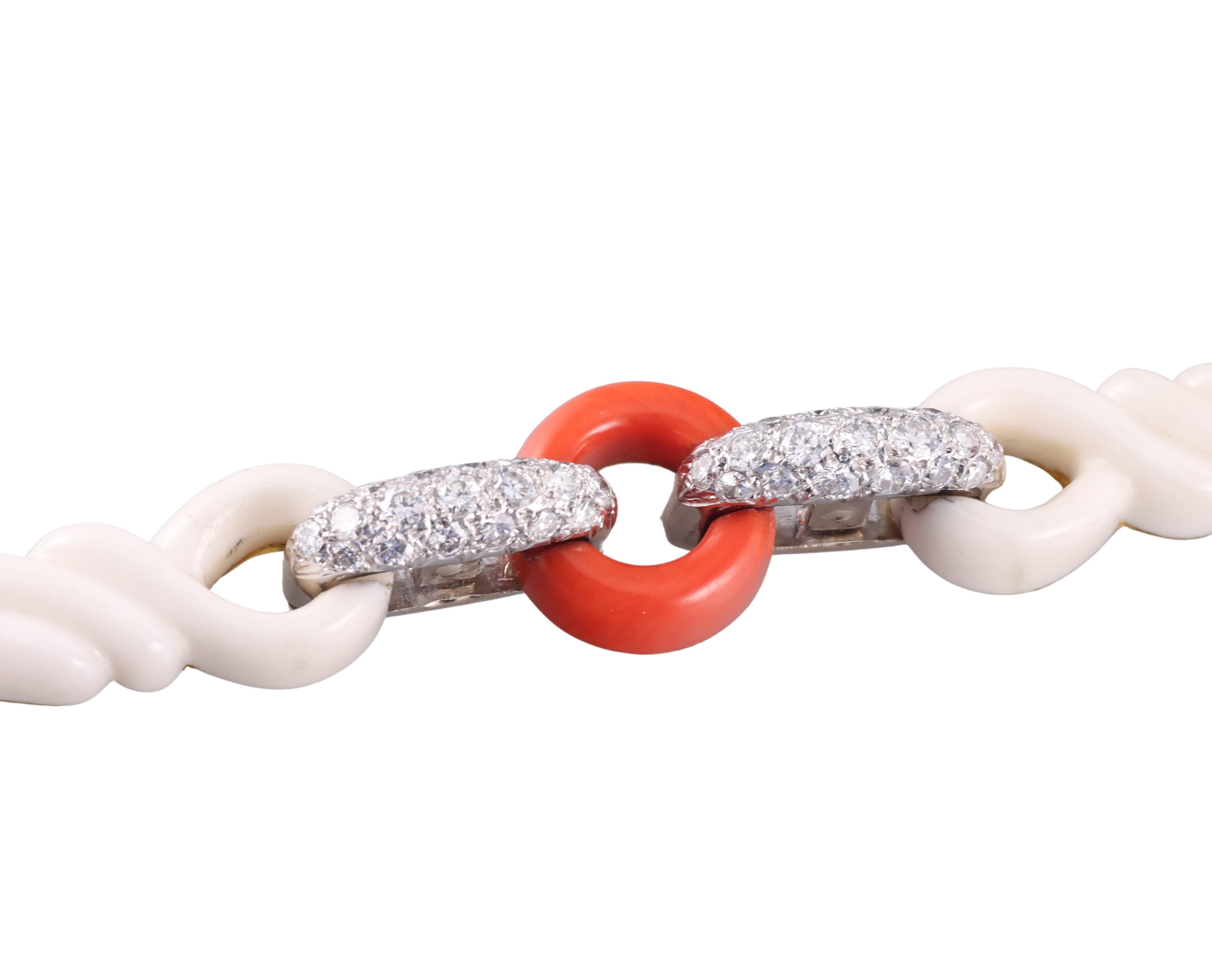 18k yellow and white gold bracelet, featuring alternating carved coral links, adorned with a total 2.60ctw SI1/H diamonds. Bracelet is 7.25