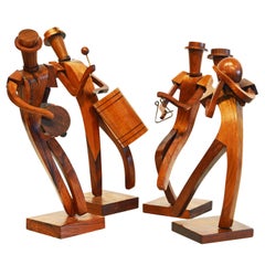 Bande de quatre musiciens en bois de rose sculpté d'Amérique latine de style cubiste du milieu du siècle dernier