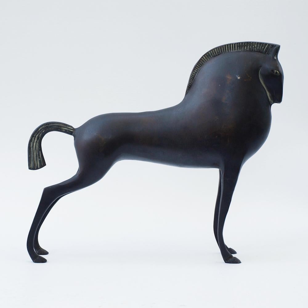 A sculpture of a Etruscan style standing horse in cold cast bronze in the manner of Boris Lovet-Lorski.
Taking classical design elements from ancient Crete and Greece aesthetics, to stylize line into decorative form.
 