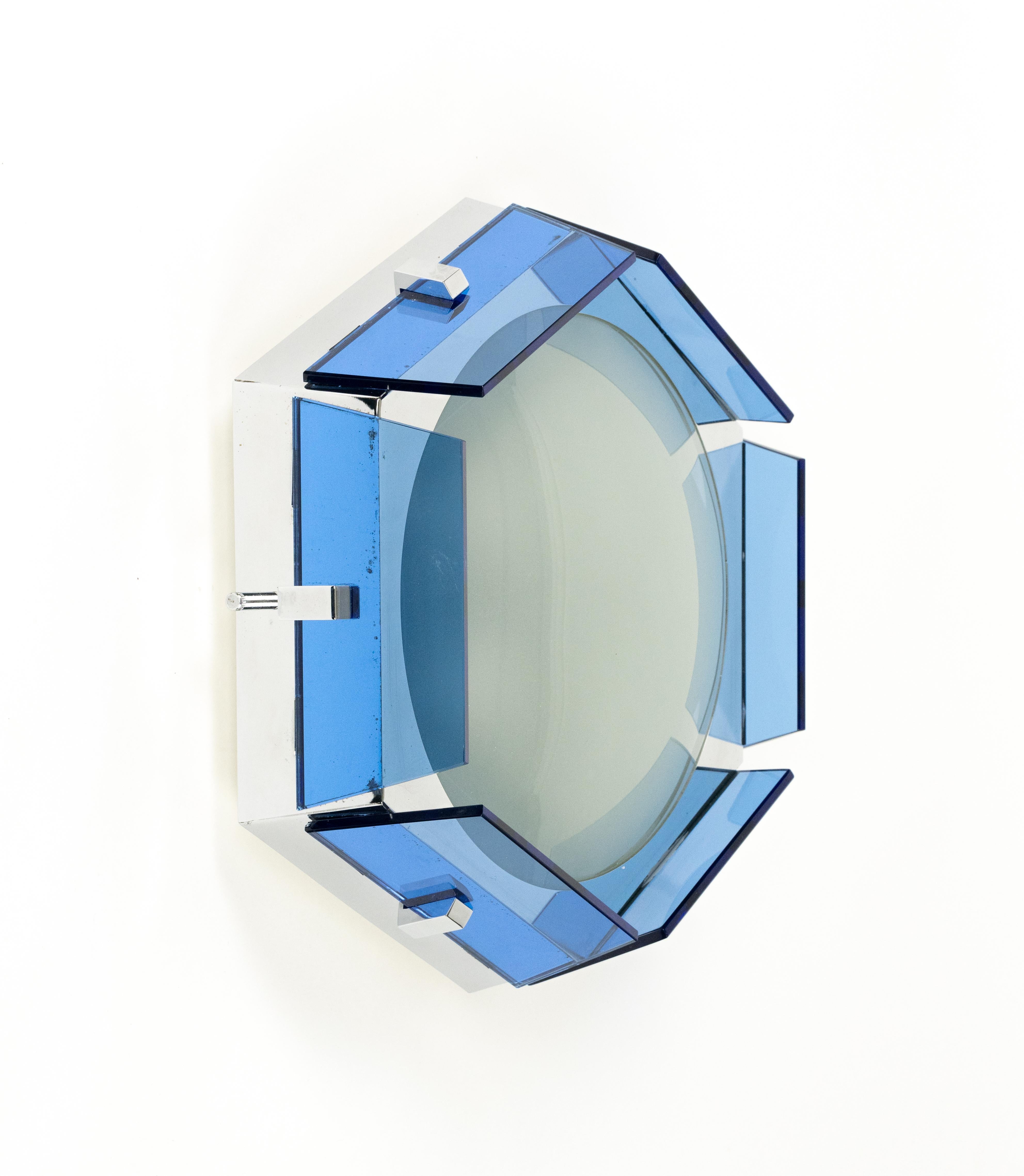 Midcentury beautiful hexagonal ceiling lamp or sconce in blue glass, opaline glass and chrome metal by Veca.

Made in Italy in the 1970s.

It uses 3 bulbs. 

The original label is still attached.